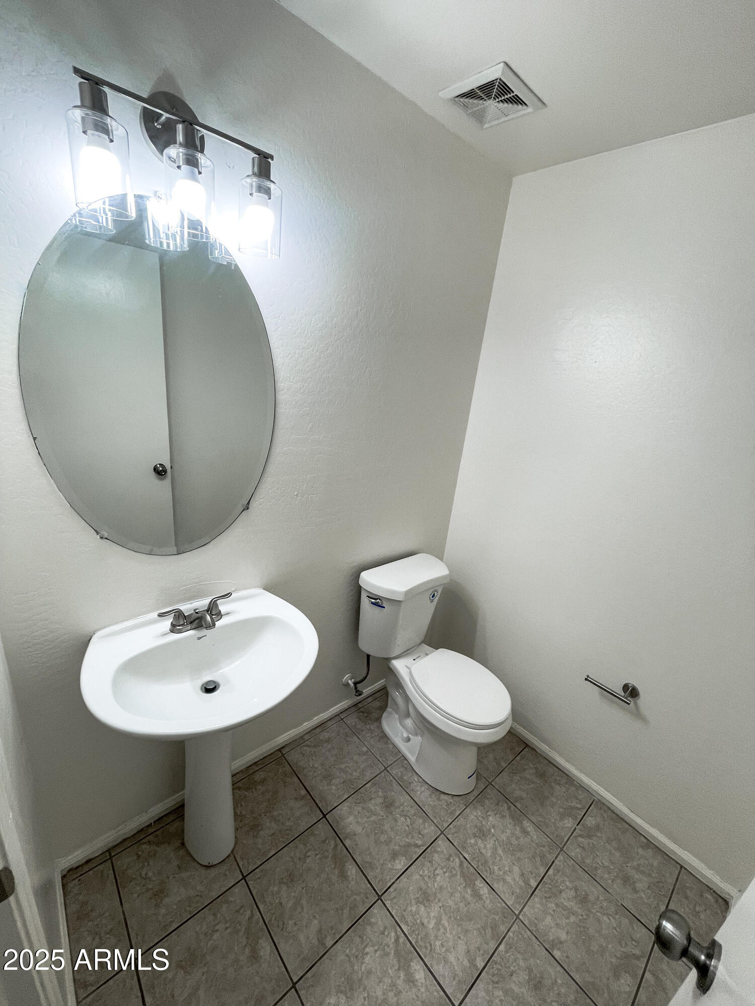 41389 Hopper Drive Maricopa, AZ 85138 - Photo 6 of 17 a bathroom with a sink a toilet and a mirror