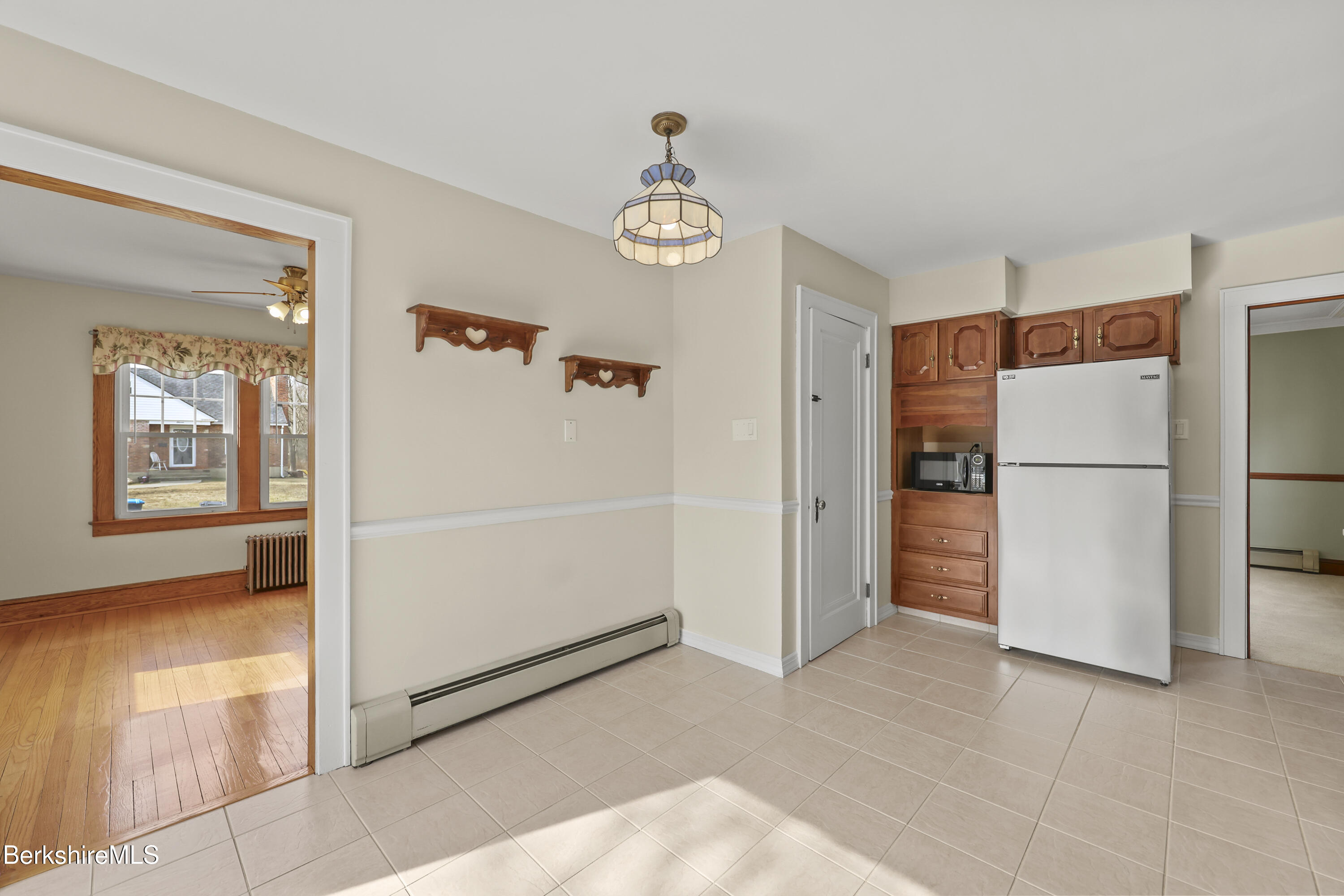 12 Sherrill Avenue Pittsfield, MA 01201 - Photo 12 of 40 a view of a hallway with a refrigerator