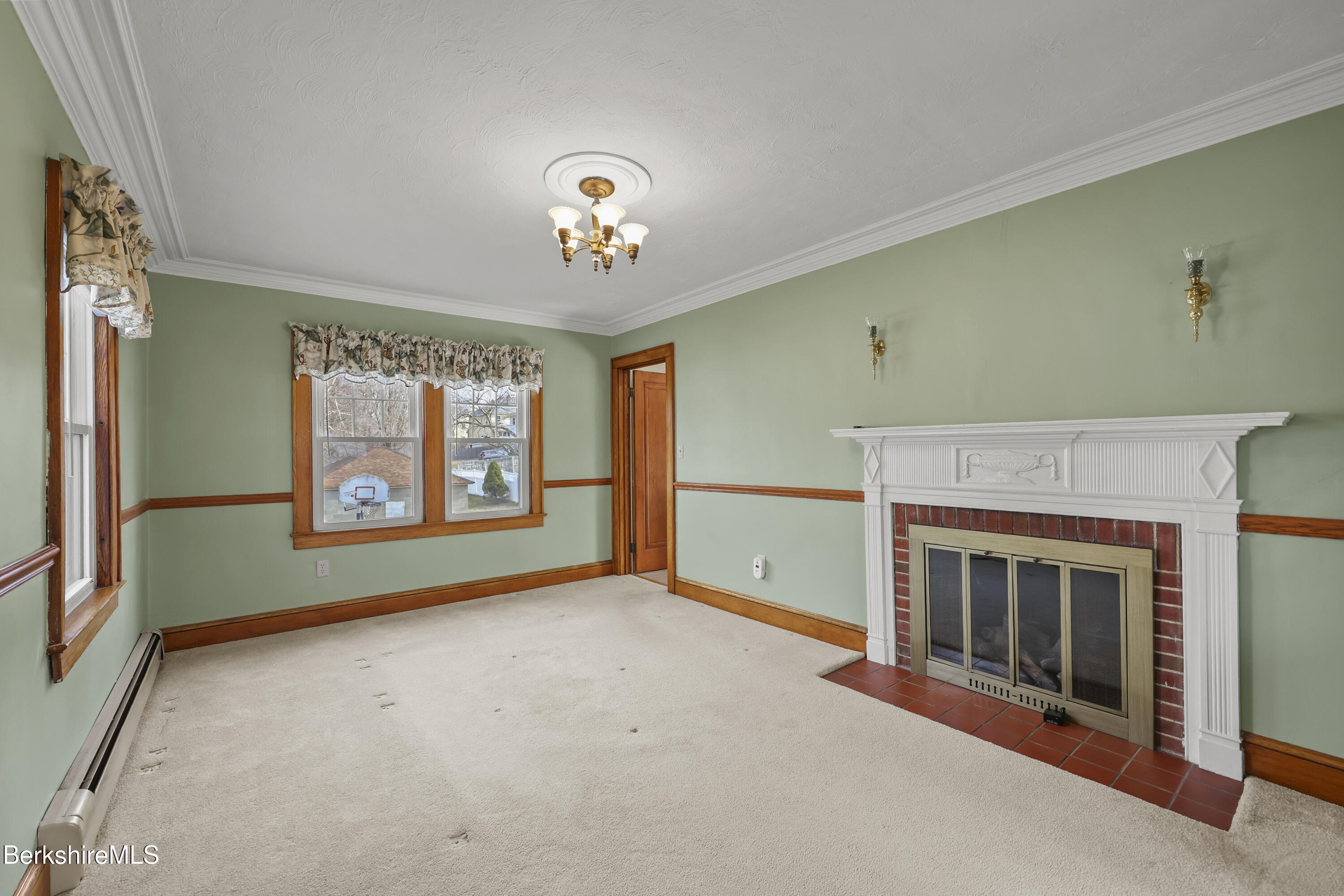 12 Sherrill Avenue Pittsfield, MA 01201 - Photo 14 of 40 an empty room with windows and fireplace