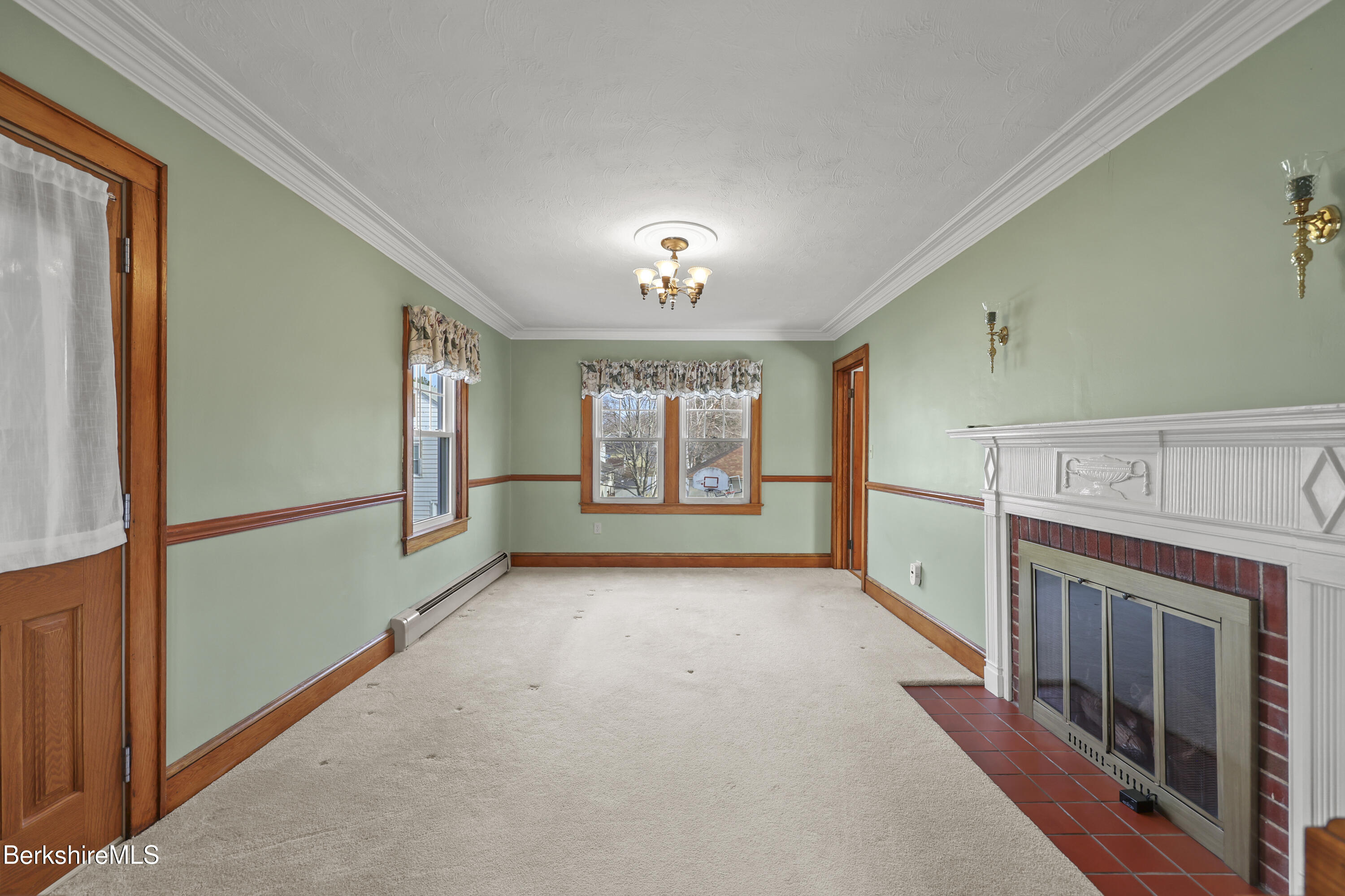 12 Sherrill Avenue Pittsfield, MA 01201 - Photo 15 of 40 a view of an empty room with window and fireplace