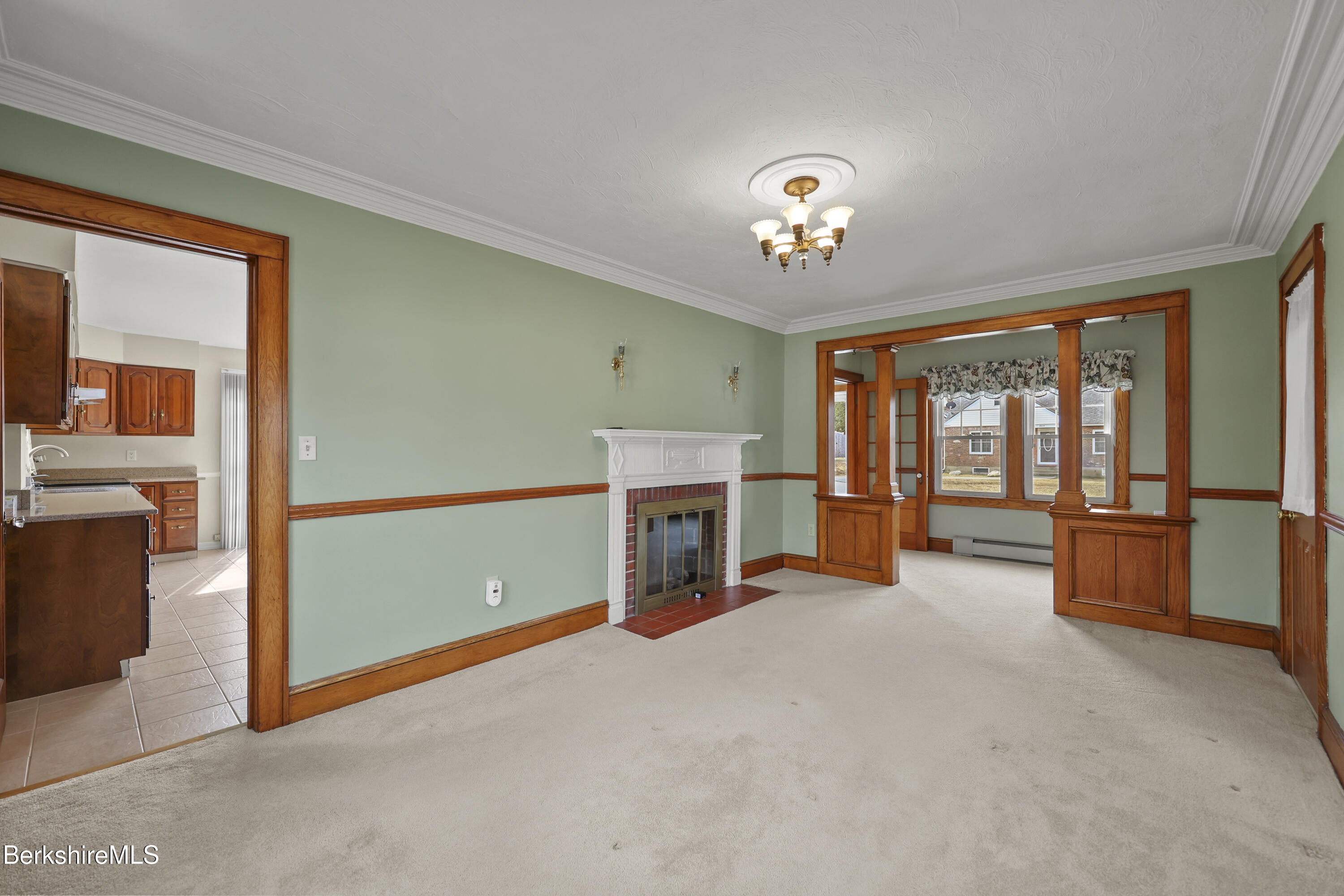 12 Sherrill Avenue Pittsfield, MA 01201 - Photo 16 of 40 a view of a livingroom with an empty space and a fireplace
