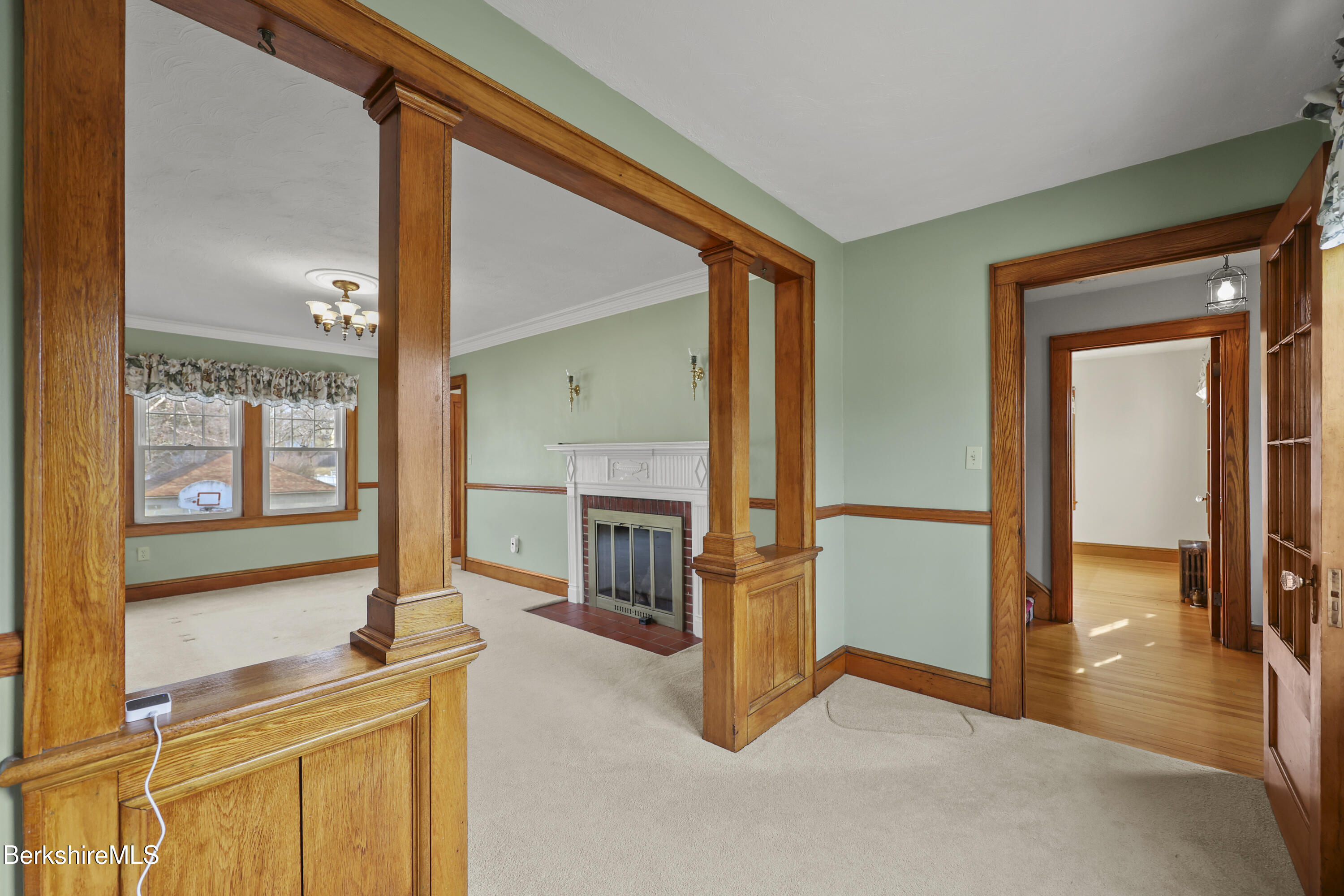 12 Sherrill Avenue Pittsfield, MA 01201 - Photo 18 of 40 a view of a hallway with furniture and a kitchen view