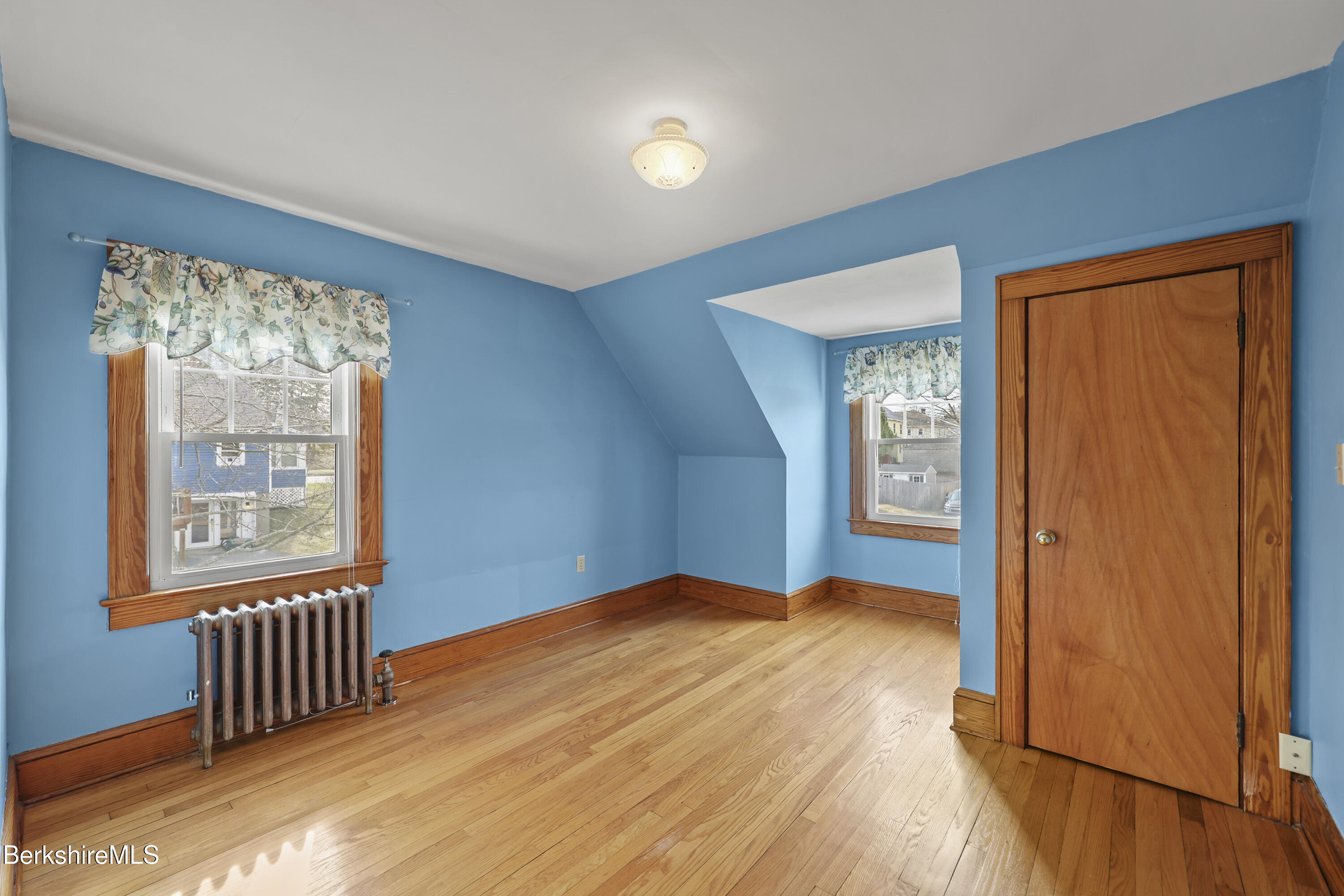 12 Sherrill Avenue Pittsfield, MA 01201 - Photo 24 of 40 a view of an empty room with glass door and wooden floor