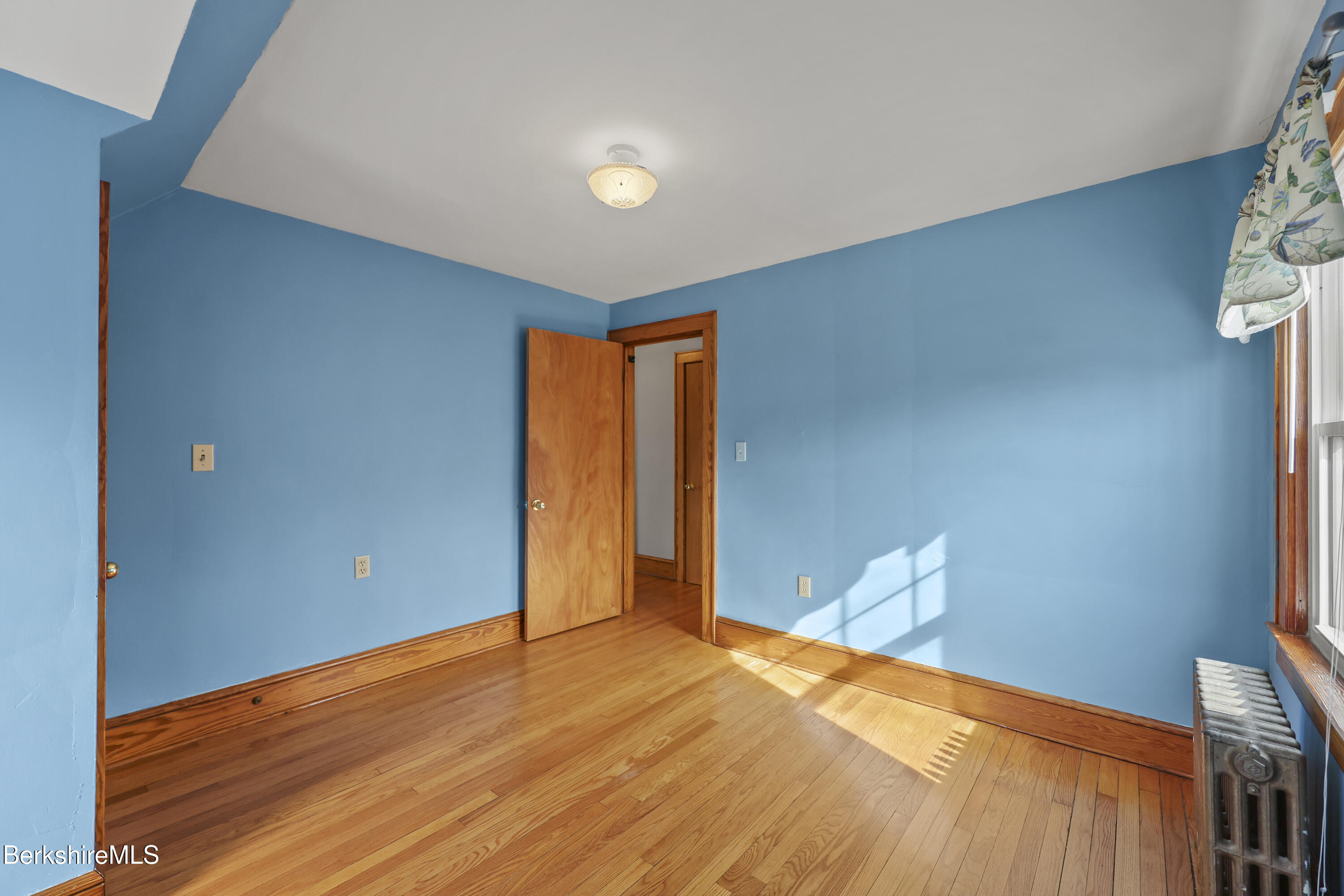 12 Sherrill Avenue Pittsfield, MA 01201 - Photo 25 of 40 a view of empty room with wooden floor
