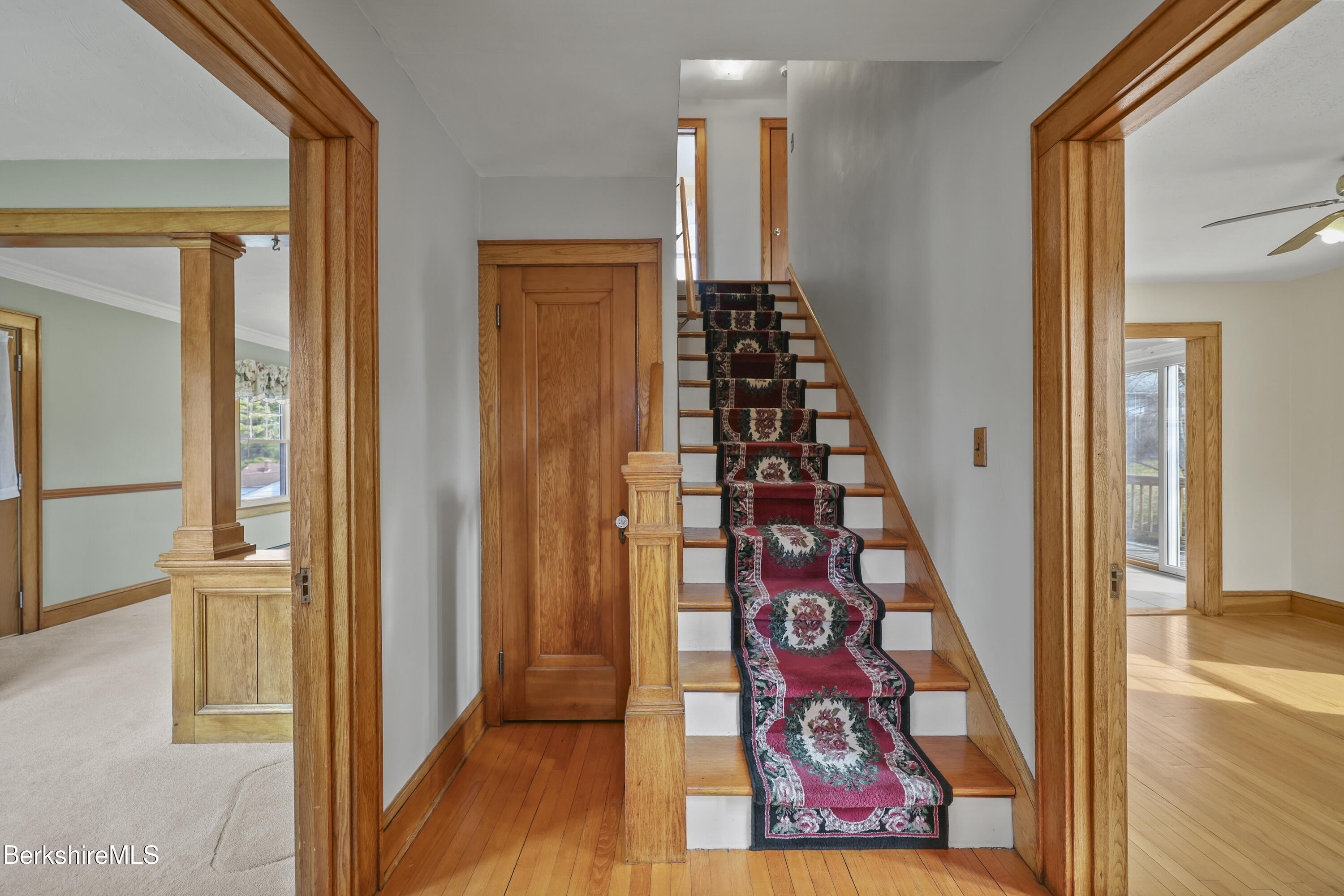 12 Sherrill Avenue Pittsfield, MA 01201 - Photo 3 of 40 a view of a hallway with wooden floor and entryway