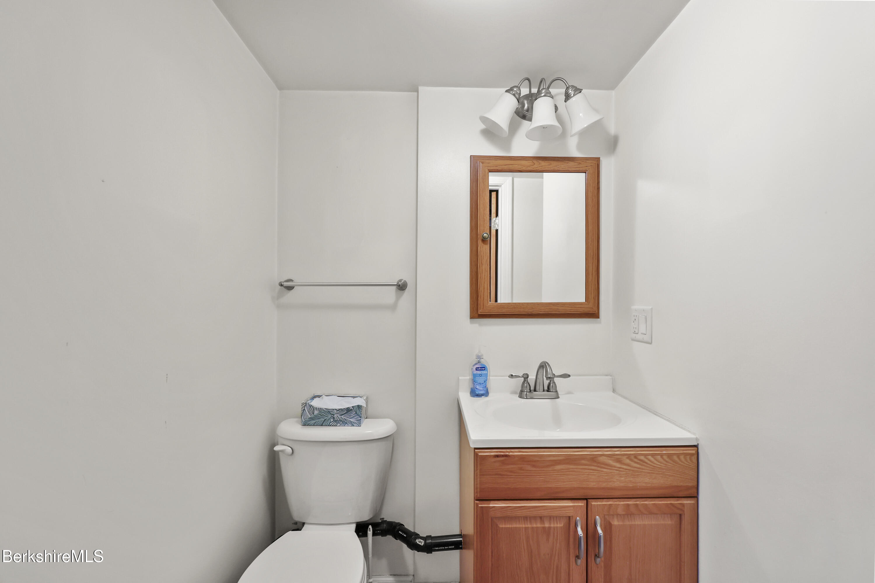 12 Sherrill Avenue Pittsfield, MA 01201 - Photo 32 of 40 a bathroom with a toilet sink and mirror
