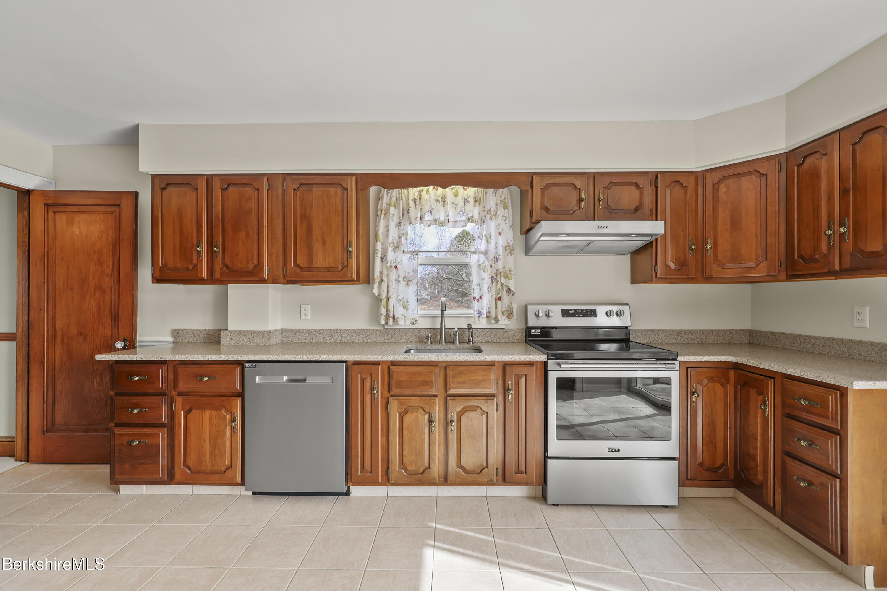 12 Sherrill Avenue Pittsfield, MA 01201 - Photo 7 of 40 a kitchen with stainless steel appliances granite countertop a stove sink and cabinets