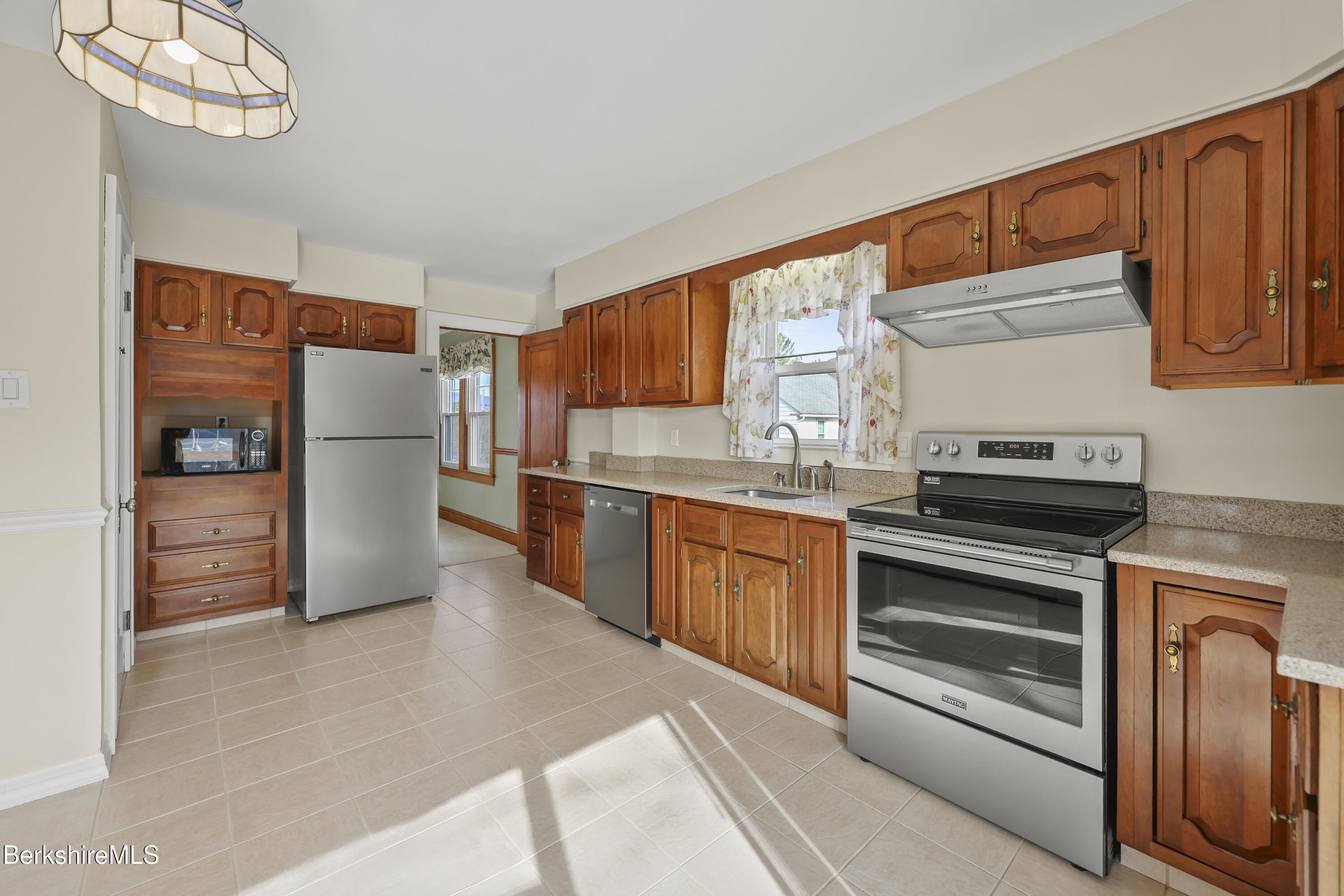 12 Sherrill Avenue Pittsfield, MA 01201 - Photo 8 of 40 a kitchen with stainless steel appliances granite countertop a refrigerator sink and stove