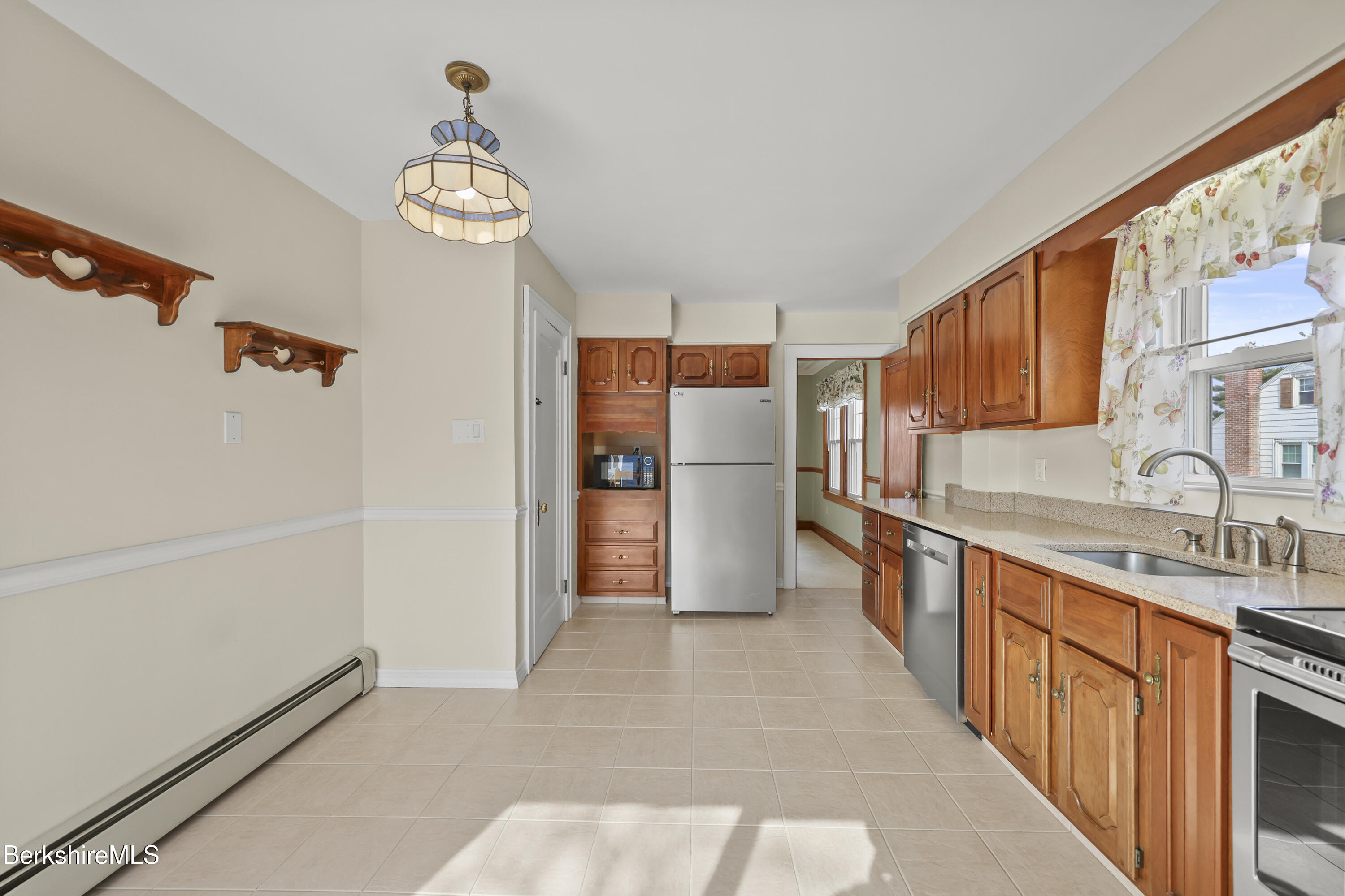12 Sherrill Avenue Pittsfield, MA 01201 - Photo 9 of 40 a kitchen with stainless steel appliances a refrigerator and a sink