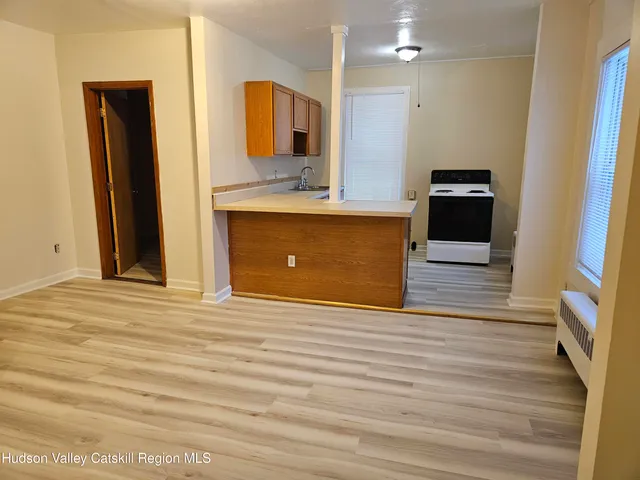 a view of a kitchen from the hallway