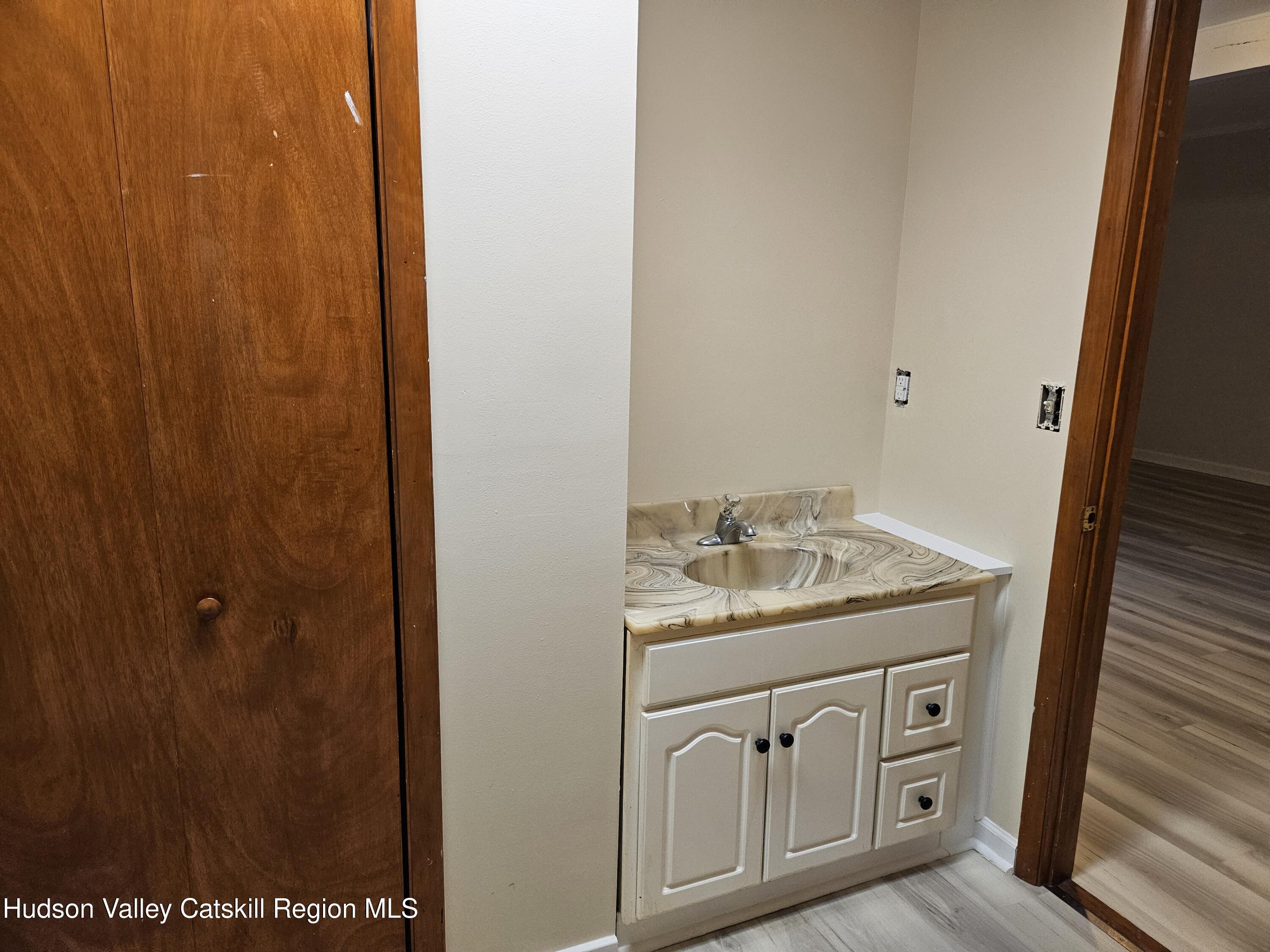 3624 County Rt 67 Freehold, NY 12431 - Photo 8 of 8 a bathroom with a granite countertop sink and a mirror