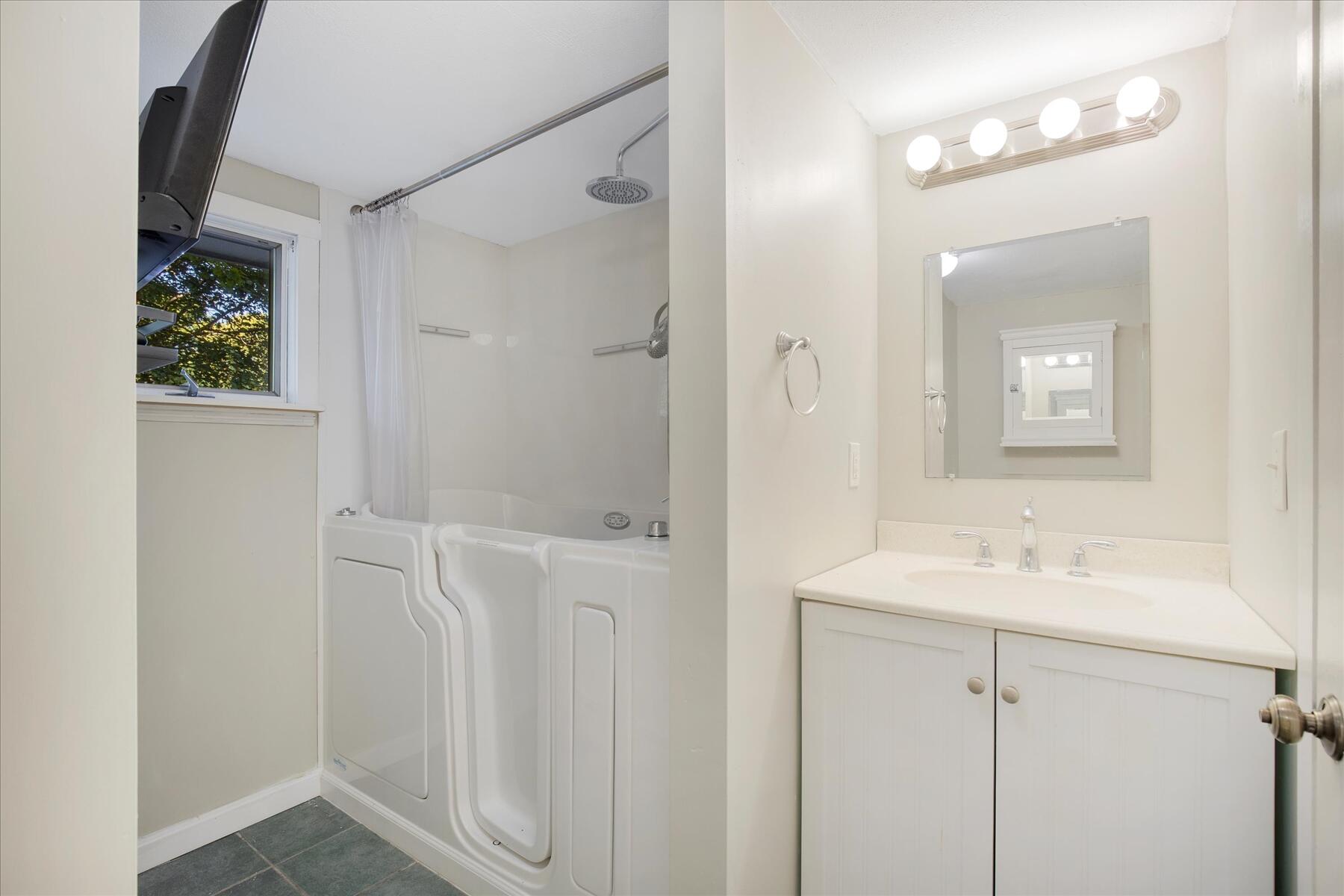254 Barlows Landing Road Pocasset, MA 02559 - Photo 15 of 27 a bathroom with a sink and a mirror