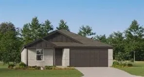 a front view of a house with a yard garage and outdoor seating