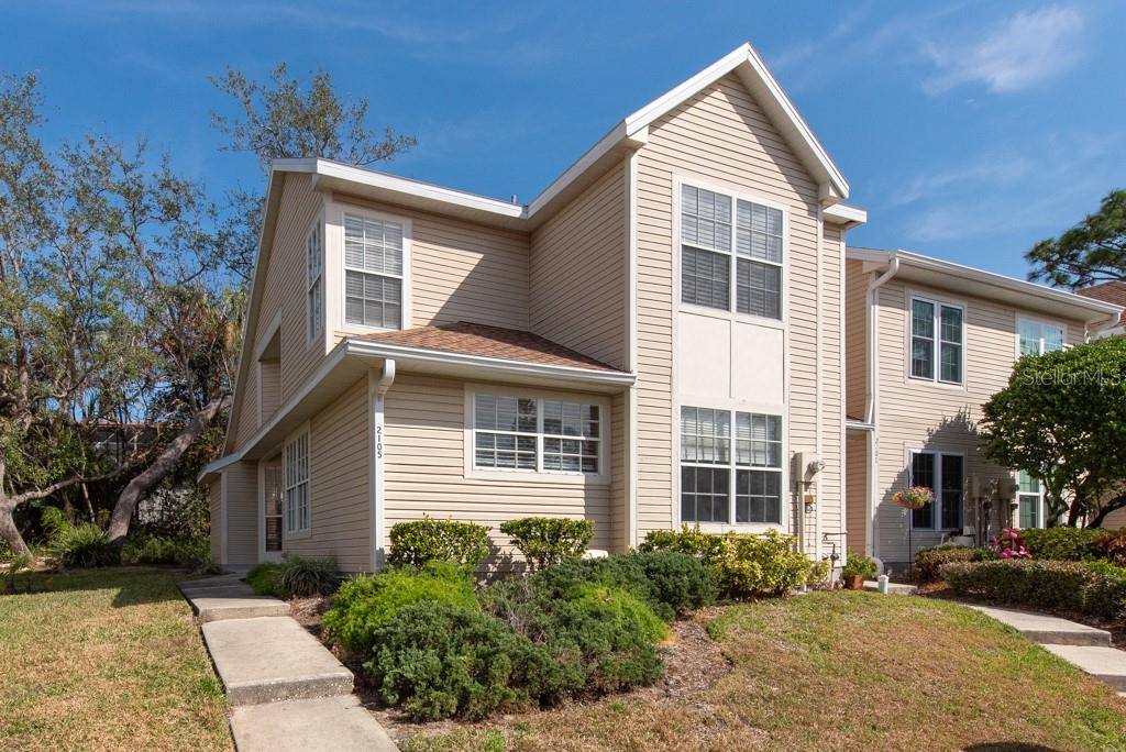 2105 Clover Hill Road Palm Harbor, FL 34683 - Photo 1 of 1 a front view of a house with a yard