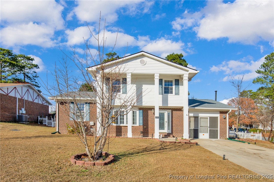 6806 Beaver Stone Road Fayetteville, NC 28314 - Photo 2 of 42 a front view of a house with a yard