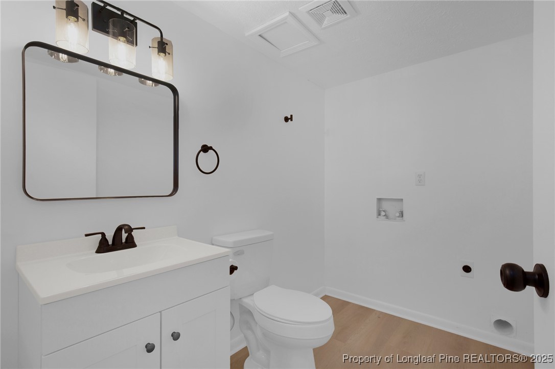 6806 Beaver Stone Road Fayetteville, NC 28314 - Photo 22 of 42 a bathroom with a sink and a mirror