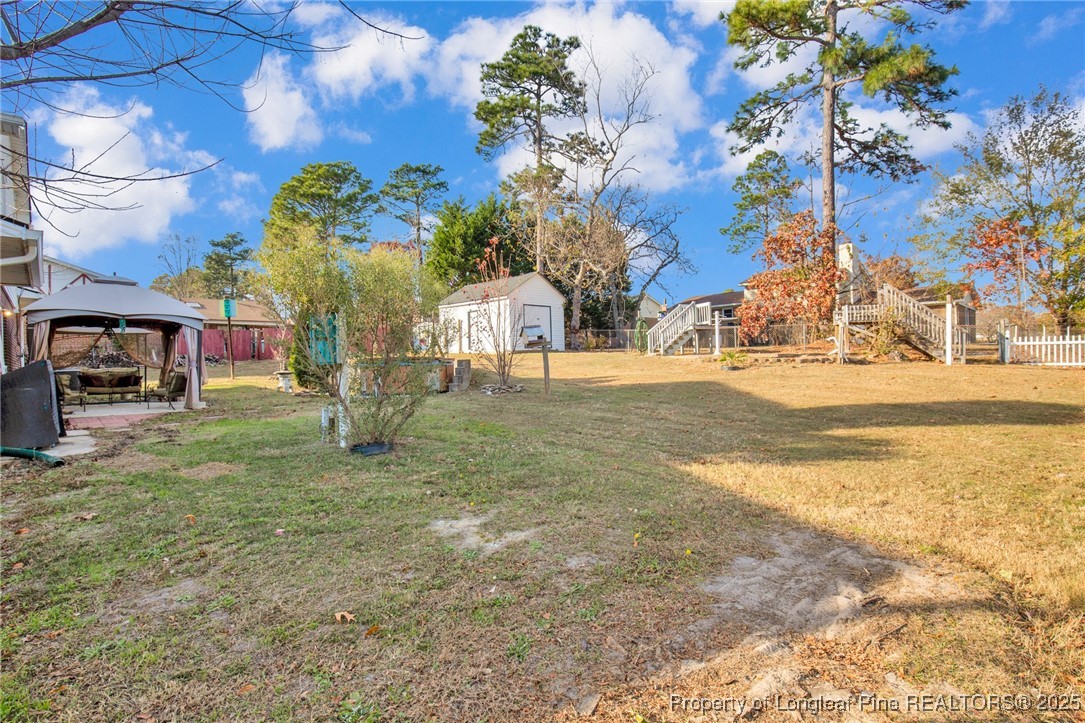 6806 Beaver Stone Road Fayetteville, NC 28314 - Photo 34 of 42 a view of a yard with a house