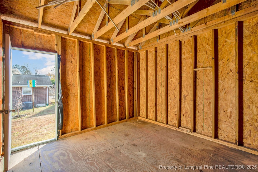 6806 Beaver Stone Road Fayetteville, NC 28314 - Photo 41 of 42 a view of a room with wooden walls