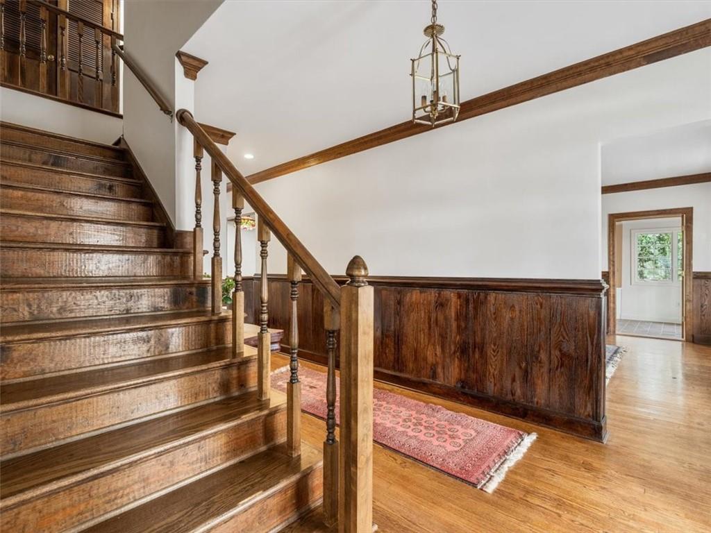 12831 Sturgeon Point Road Charles City, VA 23030 - Photo 5 of 31 Wainscot, chair rail, crown moulding and wood floors are used lavishly around the house