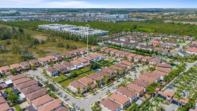 an aerial view of multiple house with a lake view