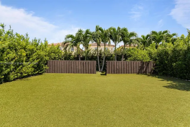 a swimming pool with wooden fence