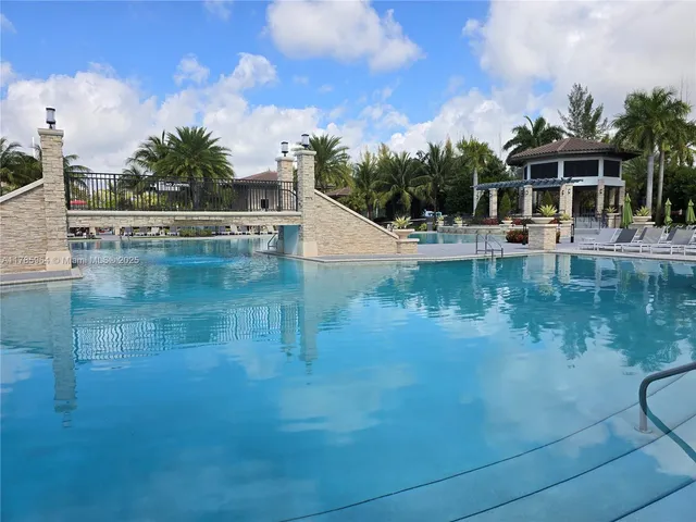 a view of pool with outdoor seating