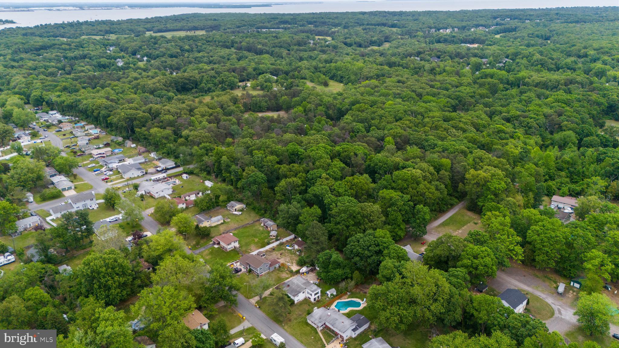 4414 Purple Martins Road Pasadena, MD 21122 - Photo 4 of 9 a view of a city with lush green forest