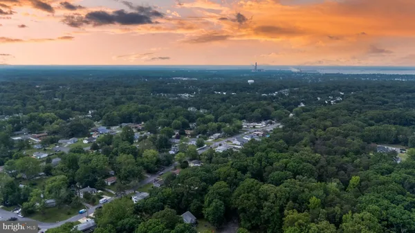 an aerial view of residential houses with outdoor and green space