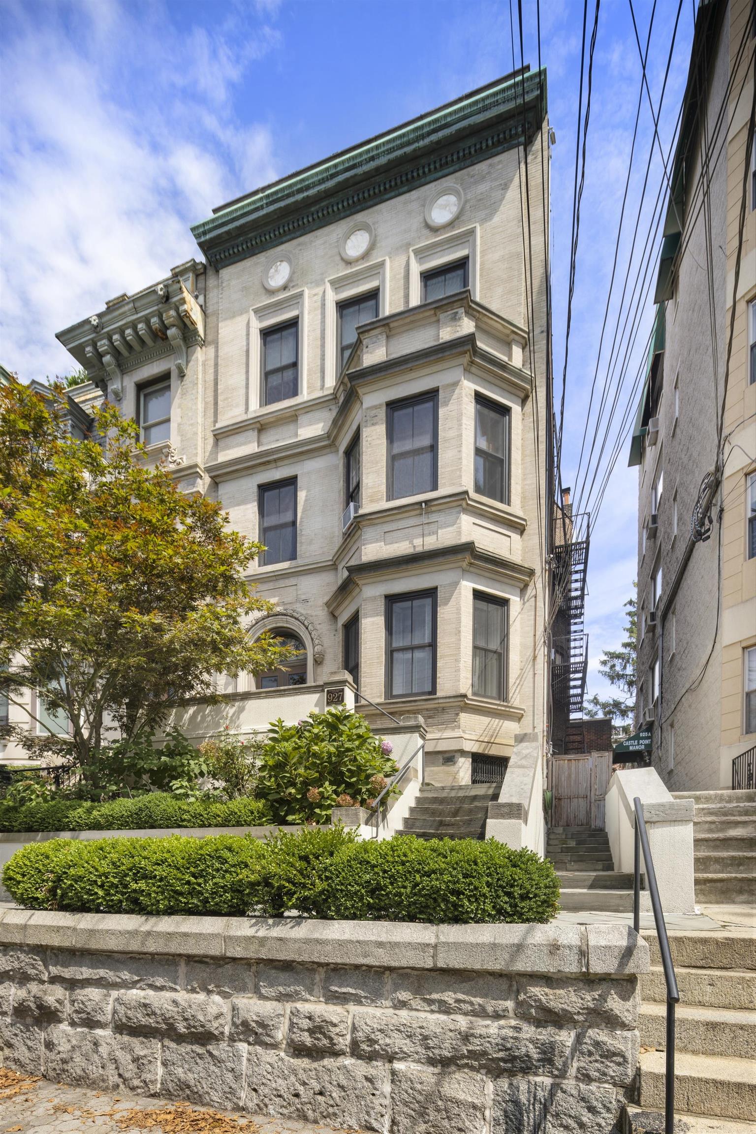 927 Hudson Street, Unit 1 Hoboken, NJ 07030 - Photo 1 of 49 a front view of a residential apartment building with a yard