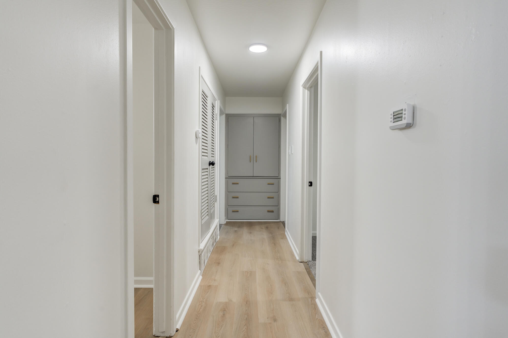 4404 28th Street Lubbock, TX 79410 - Photo 22 of 39 a view of a hallway with wooden floor