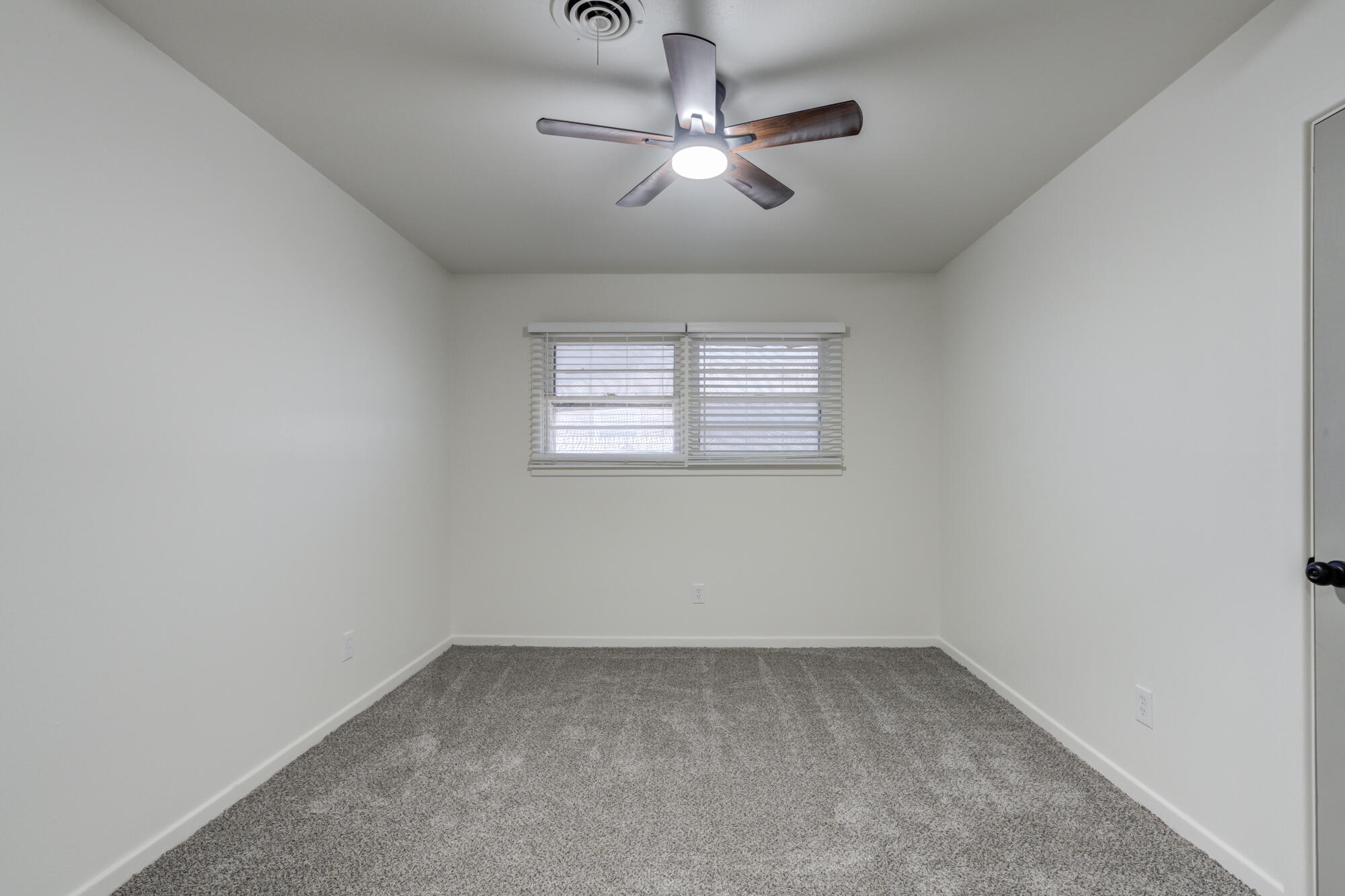 4404 28th Street Lubbock, TX 79410 - Photo 26 of 39 an empty room with a window