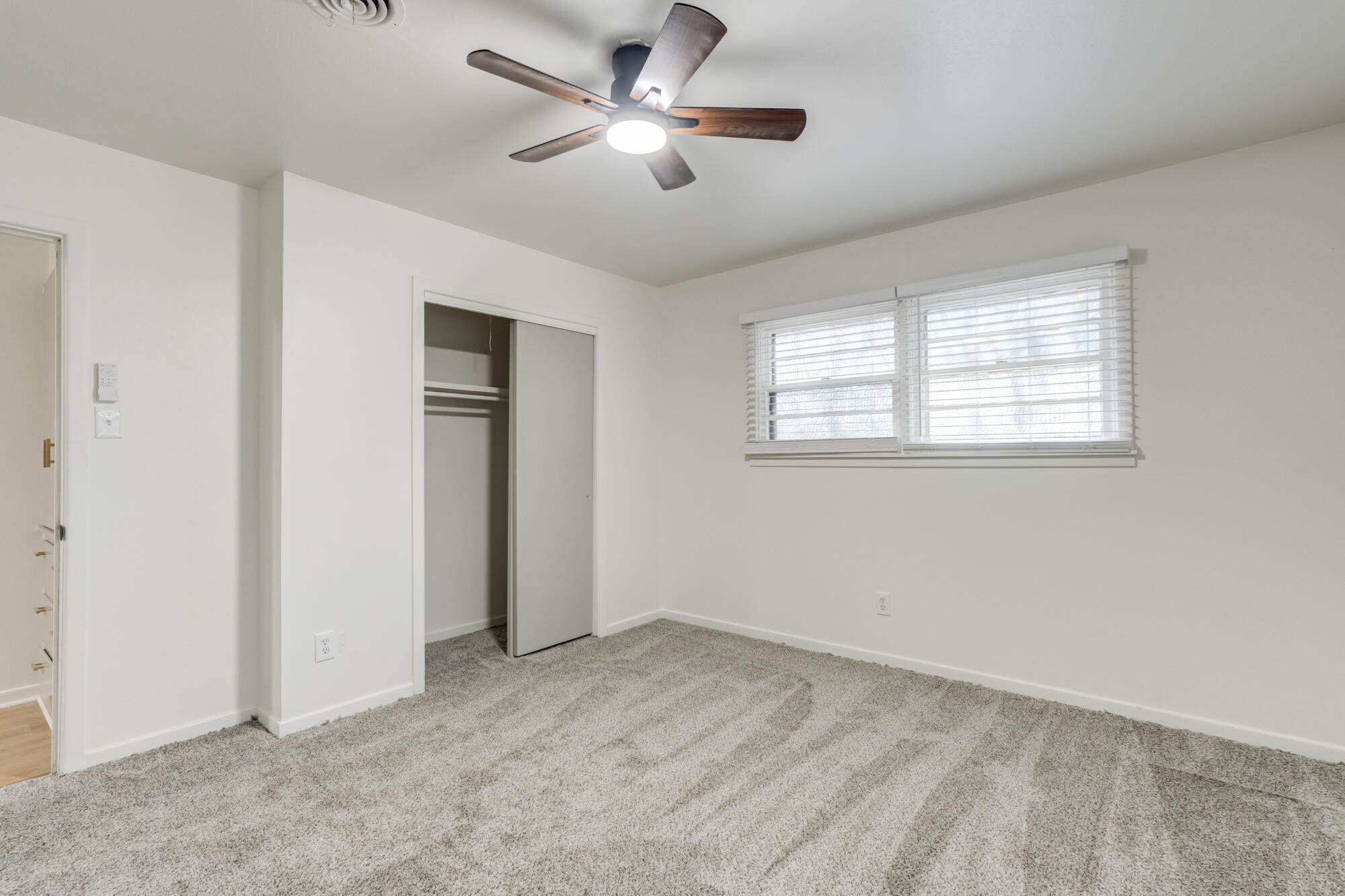 4404 28th Street Lubbock, TX 79410 - Photo 29 of 39 a view of a livingroom with a ceiling fan and window