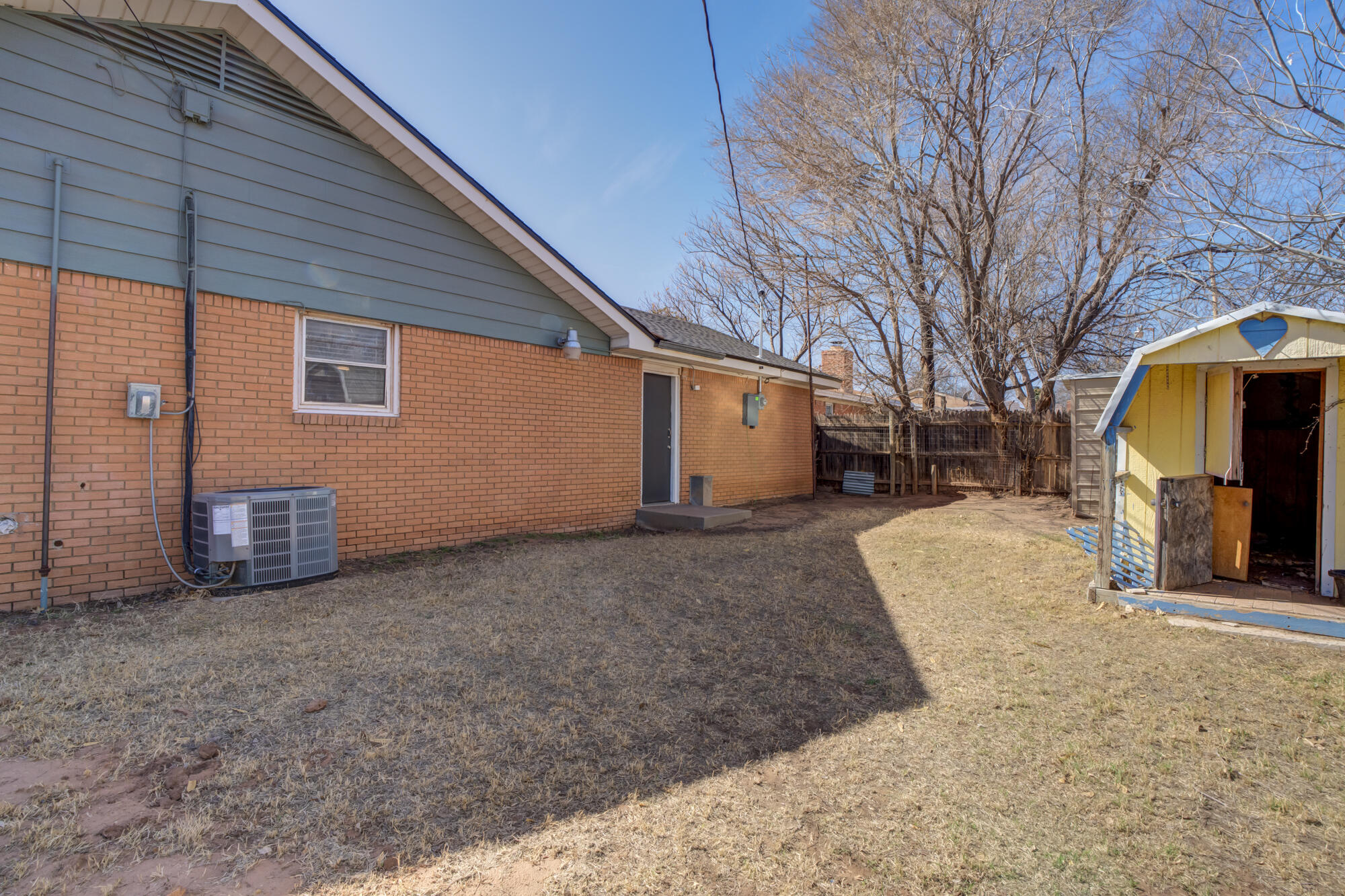 4404 28th Street Lubbock, TX 79410 - Photo 37 of 39 a view of a backyard of the house