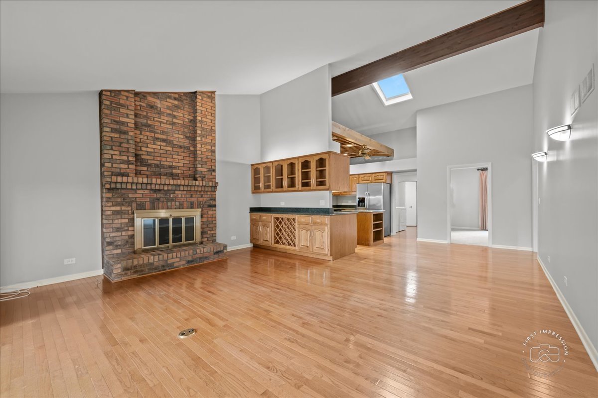 1105 West Bauer Road Naperville, IL 60563 - Photo 15 of 39 a view of a kitchen with furniture and an empty room