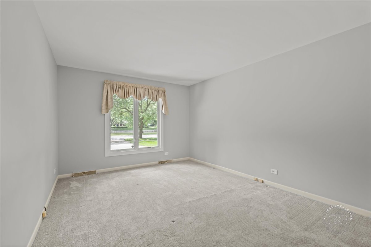1105 West Bauer Road Naperville, IL 60563 - Photo 23 of 39 an empty room with a window
