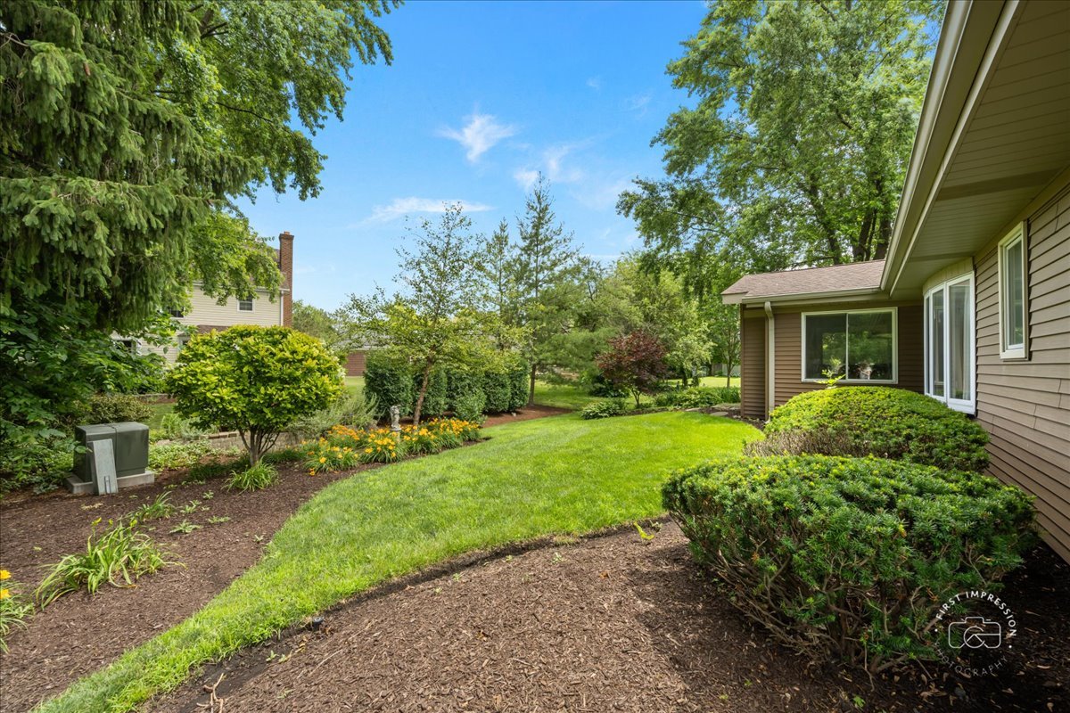 1105 West Bauer Road Naperville, IL 60563 - Photo 27 of 39 a front view of a house with a yard