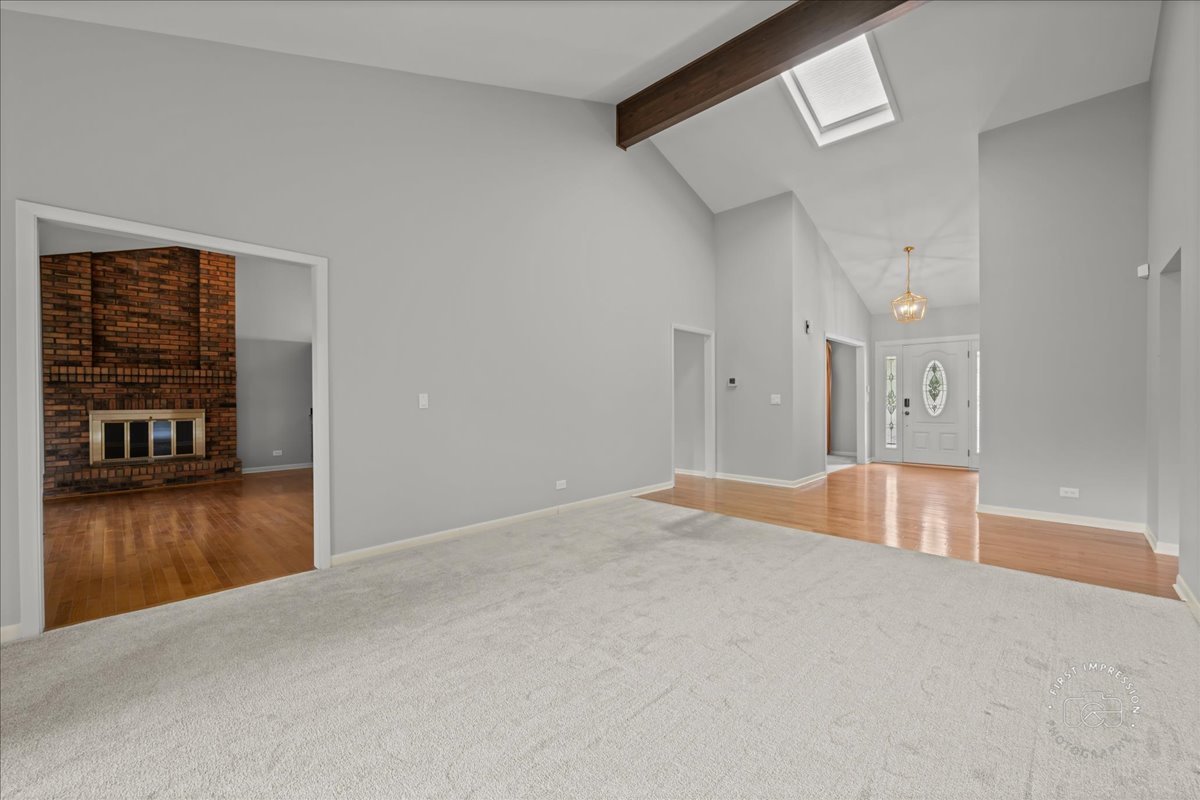 1105 West Bauer Road Naperville, IL 60563 - Photo 8 of 39 a view of a livingroom with furniture and wooden floor