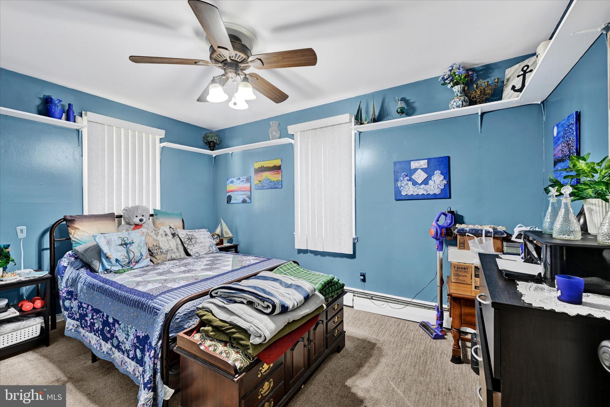 1321 Rustic Avenue Baltimore, MD 21237 - Photo 15 of 28 a bedroom with a bed and a chandelier