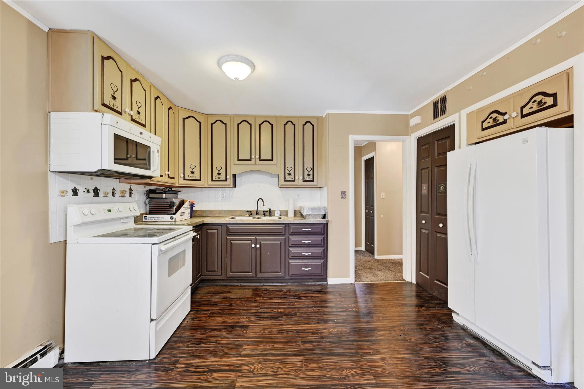 1321 Rustic Avenue Baltimore, MD 21237 - Photo 23 of 28 a kitchen with stainless steel appliances granite countertop a refrigerator and a stove top oven
