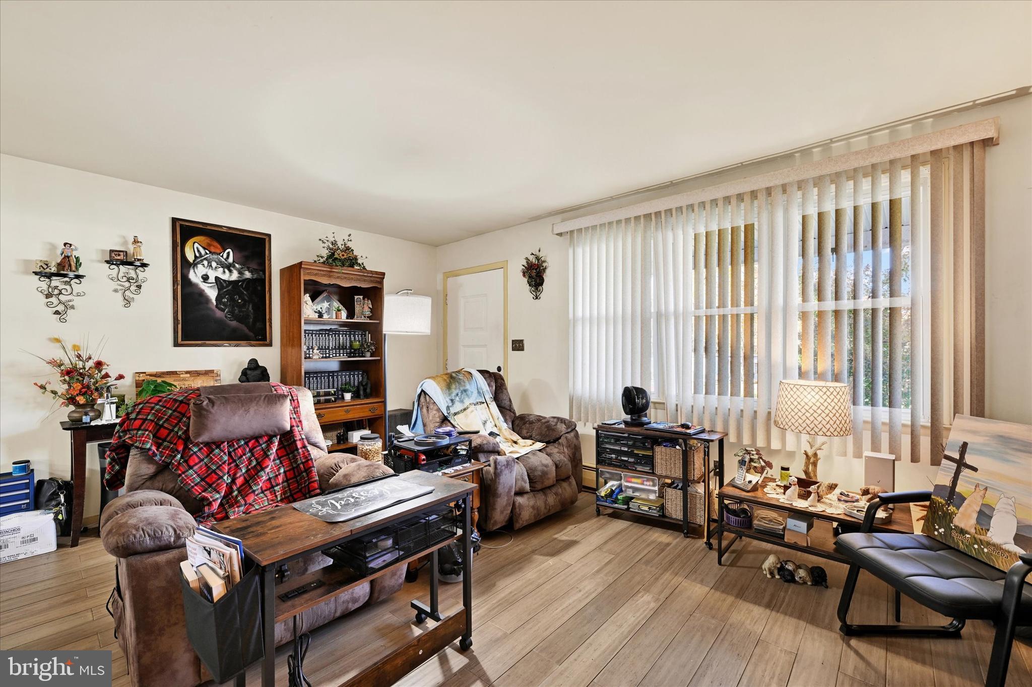 1321 Rustic Avenue Baltimore, MD 21237 - Photo 7 of 28 a living room with furniture and large windows