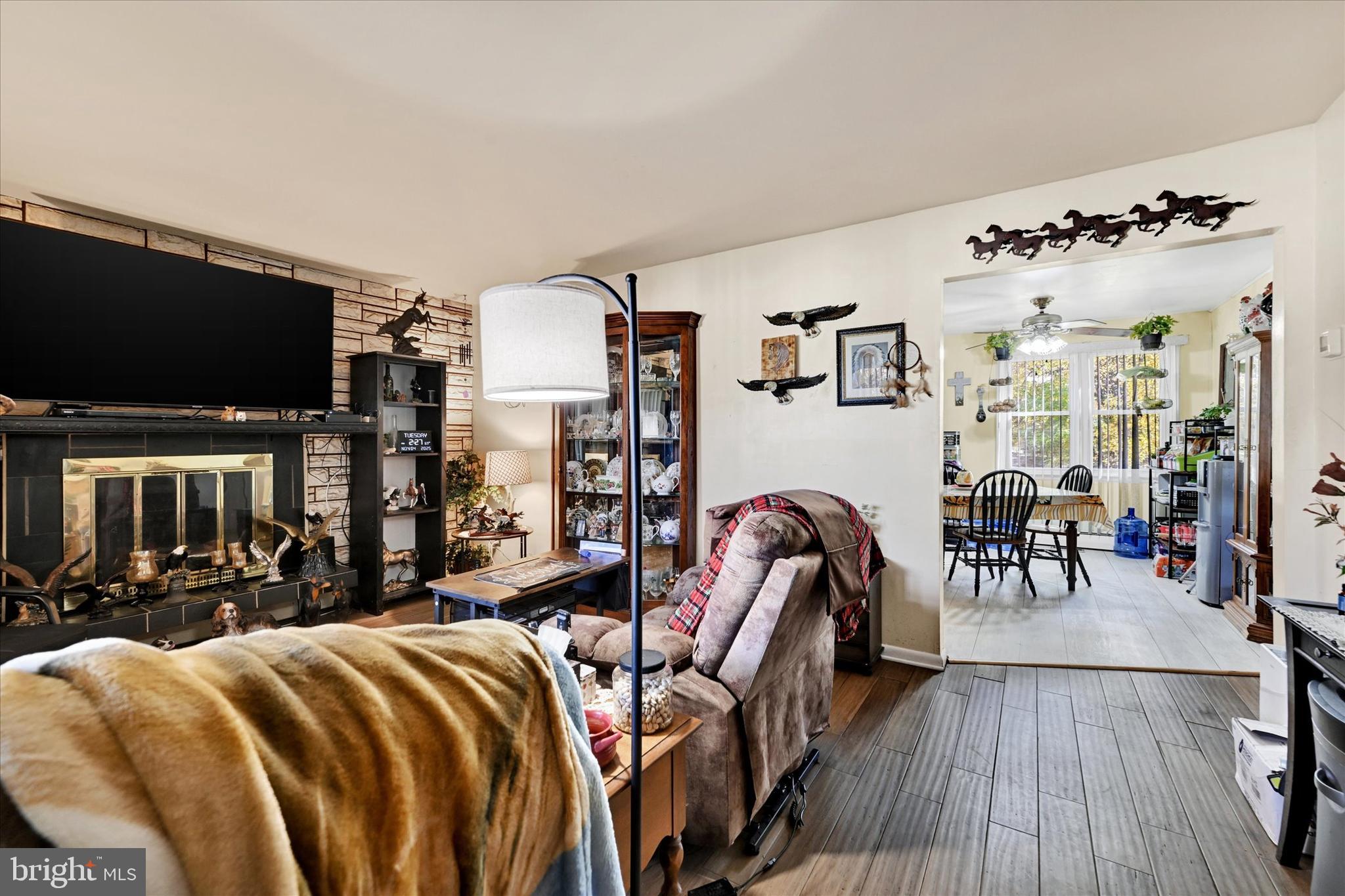 1321 Rustic Avenue Baltimore, MD 21237 - Photo 8 of 28 a bed room with furniture and a flat screen tv