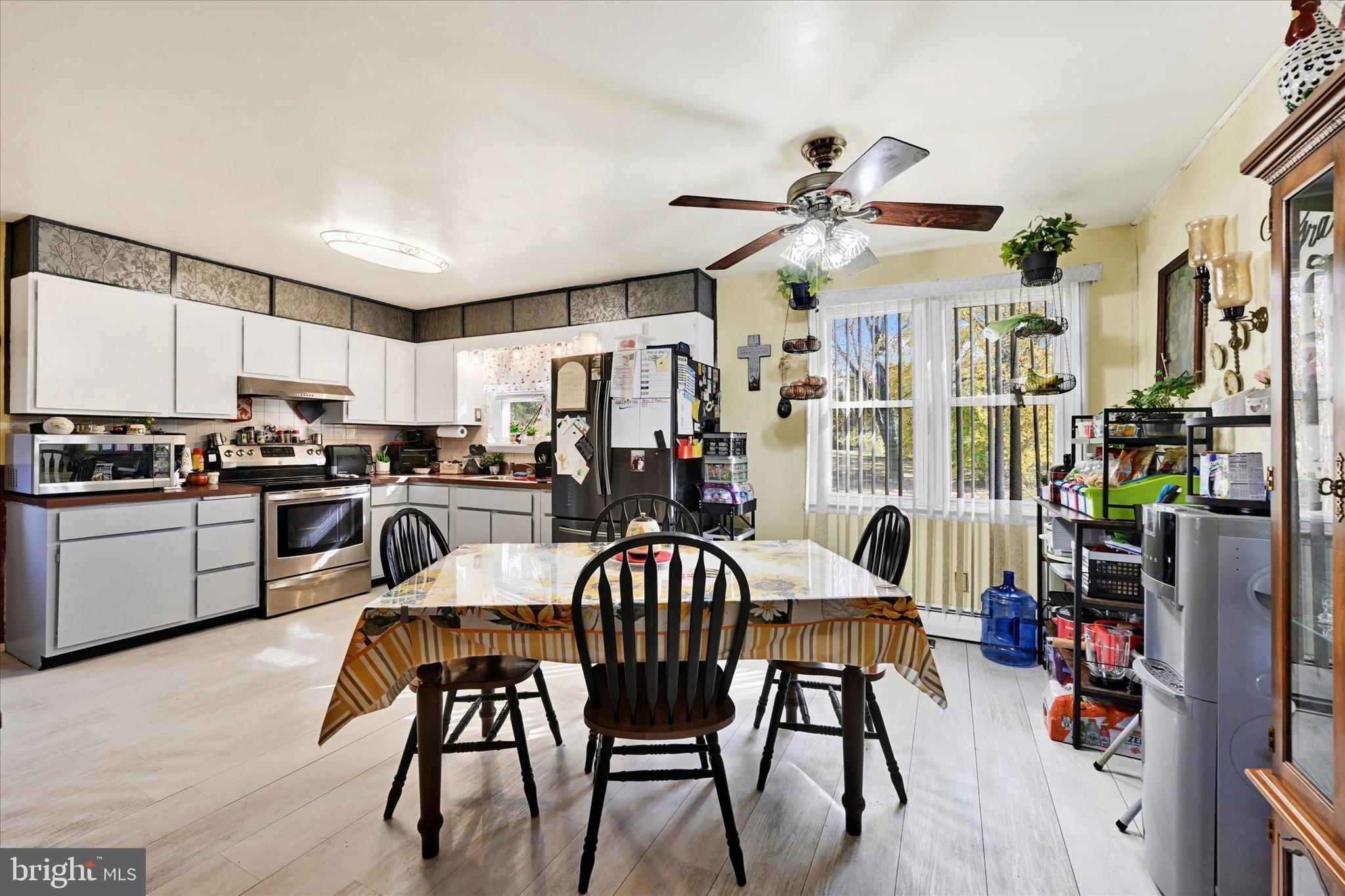 1321 Rustic Avenue Baltimore, MD 21237 - Photo 9 of 28 a view of a dining room with furniture and chandelier