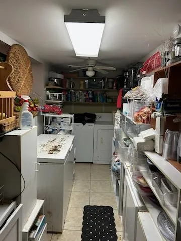 a kitchen with a stove and a wooden floor