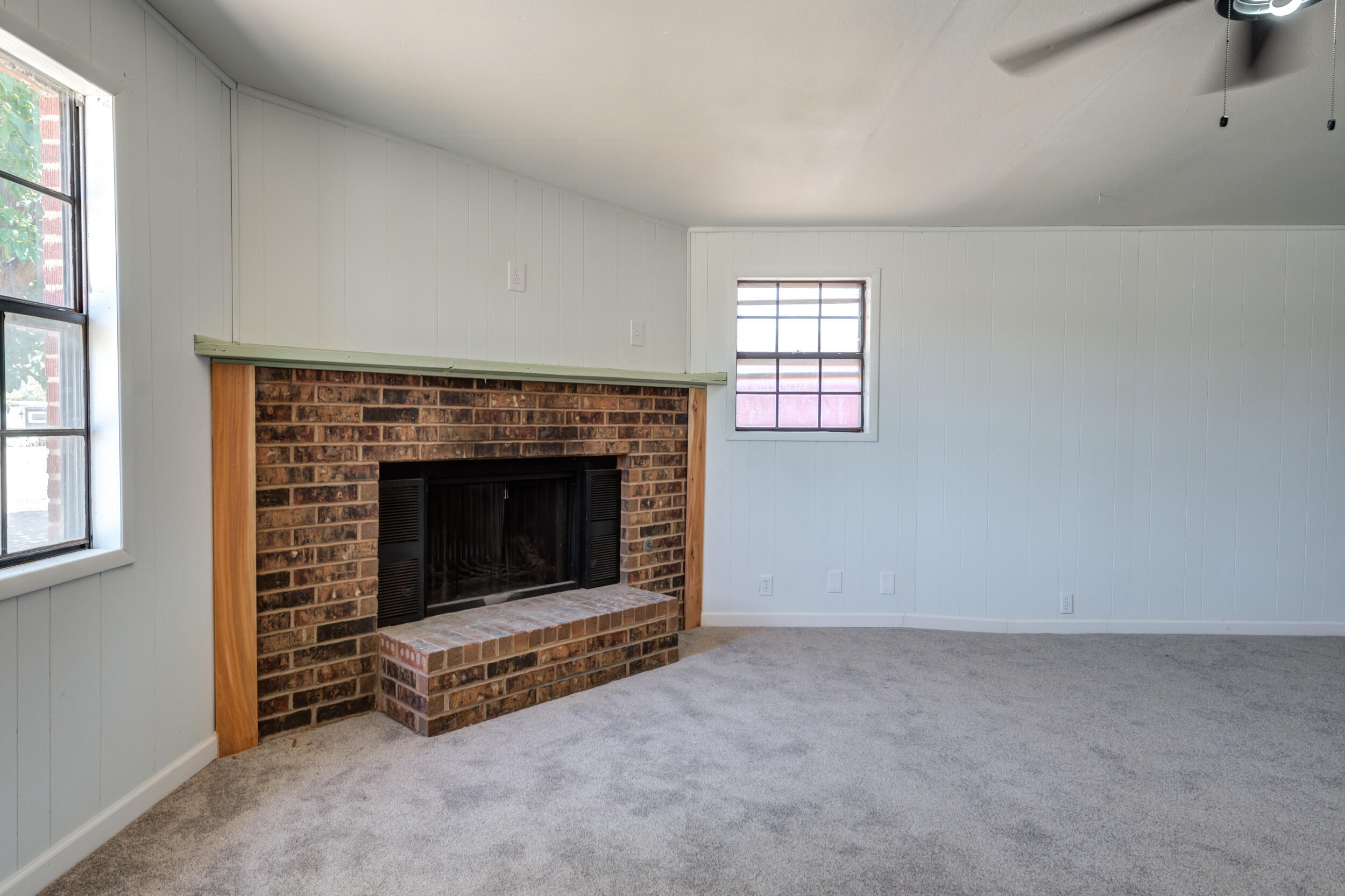 2525 63rd Street Lubbock, TX 79413 - Photo 2 of 14 an empty room with windows