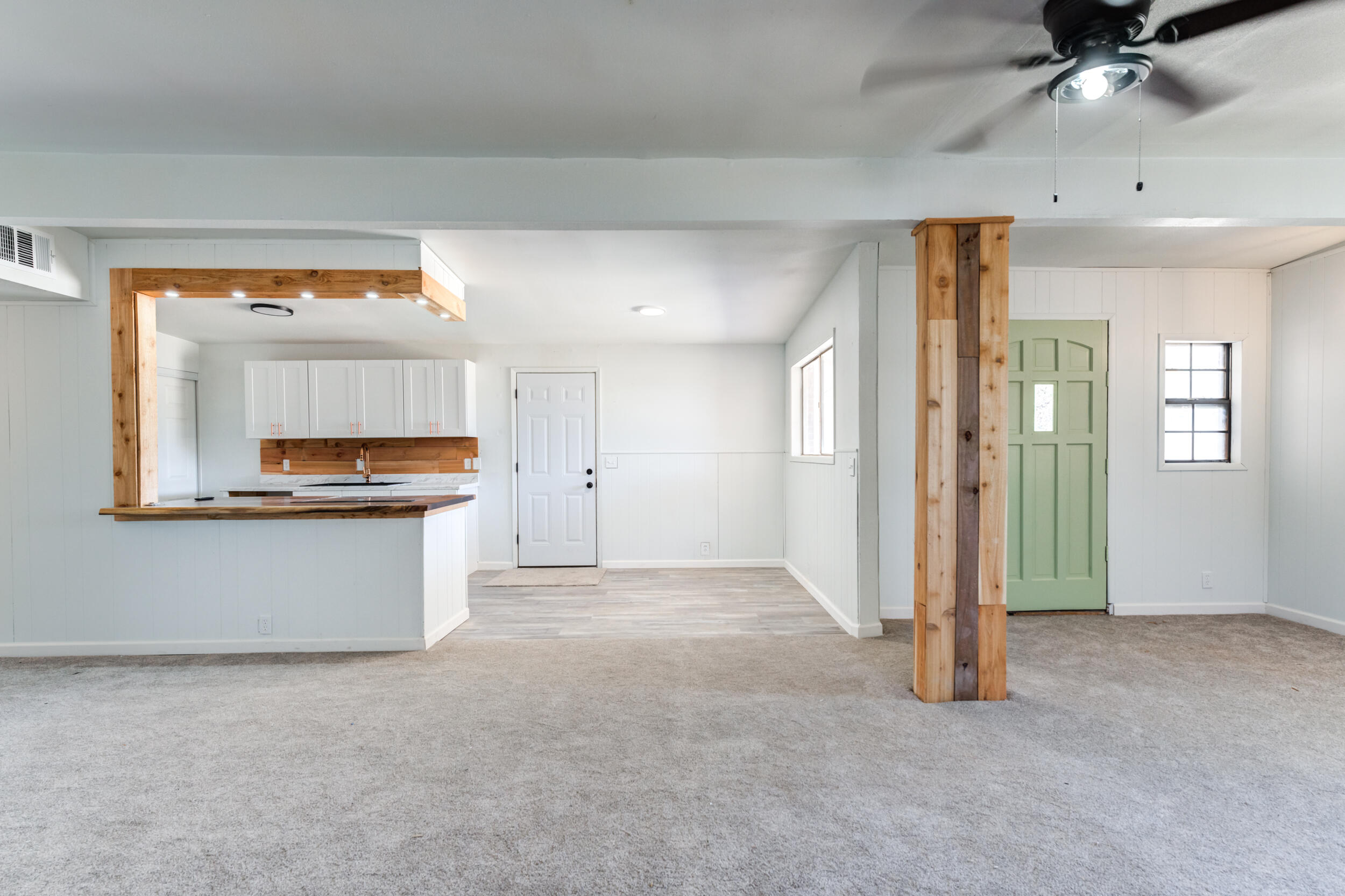 2525 63rd Street Lubbock, TX 79413 - Photo 5 of 14 a view of a kitchen with a sink cabinets and a window