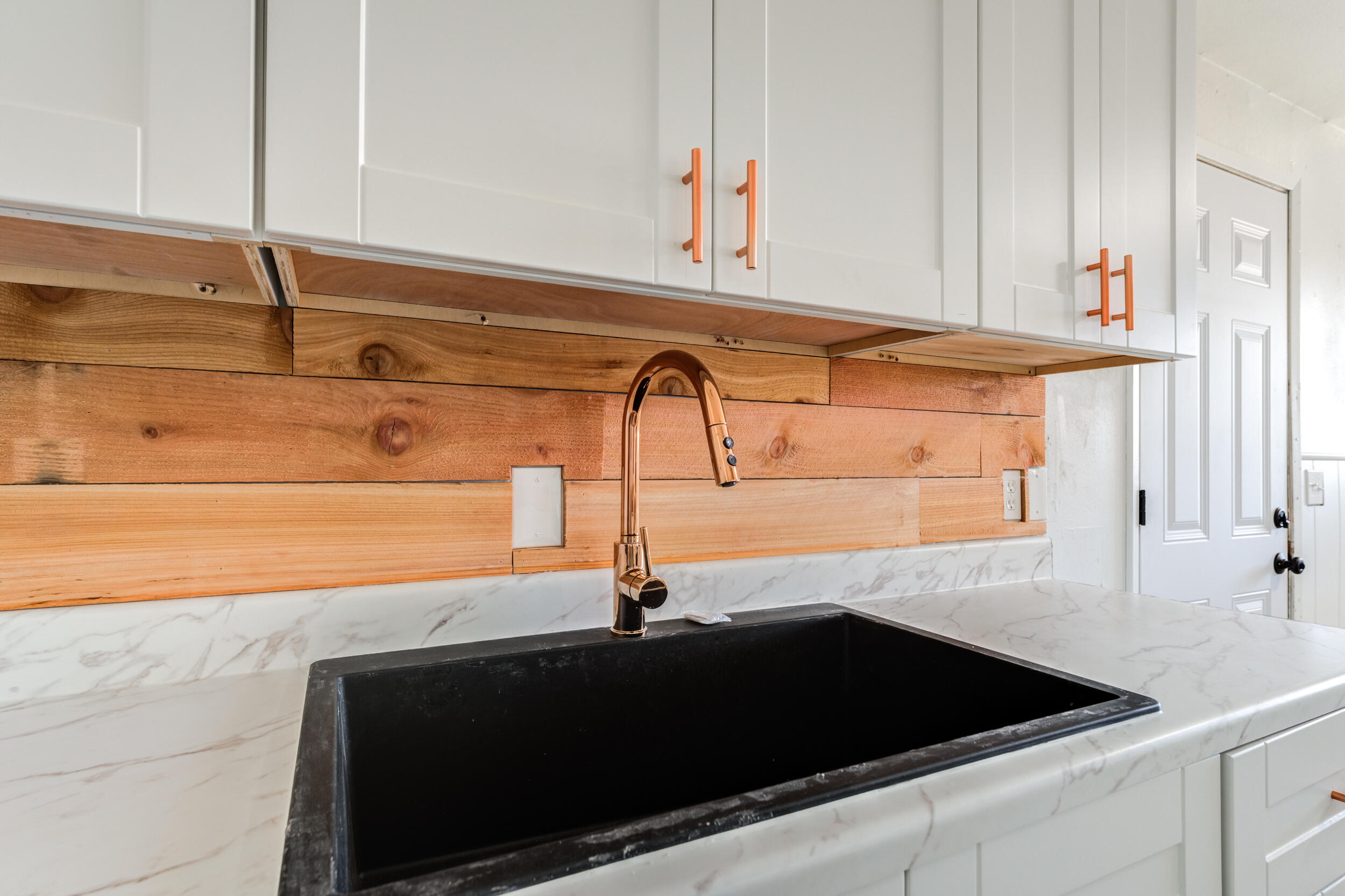 2525 63rd Street Lubbock, TX 79413 - Photo 9 of 14 a close view of a sink and dishwasher with kitchen island