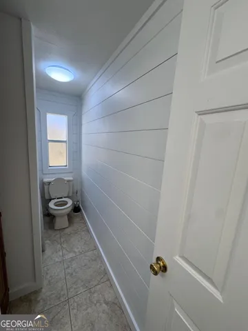 an empty room with a fan