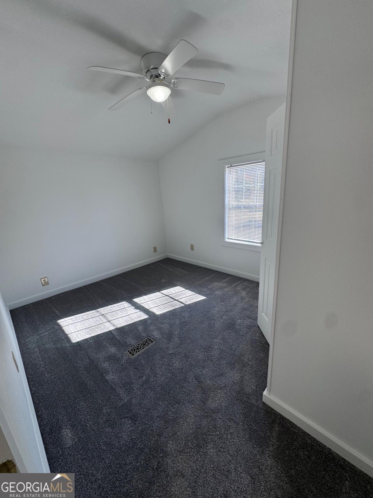 347 Benton Powell Road Uvalda, GA 30473 - Photo 13 of 39 an empty room with a fan