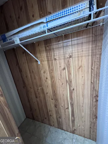 a view of bedroom and hallway