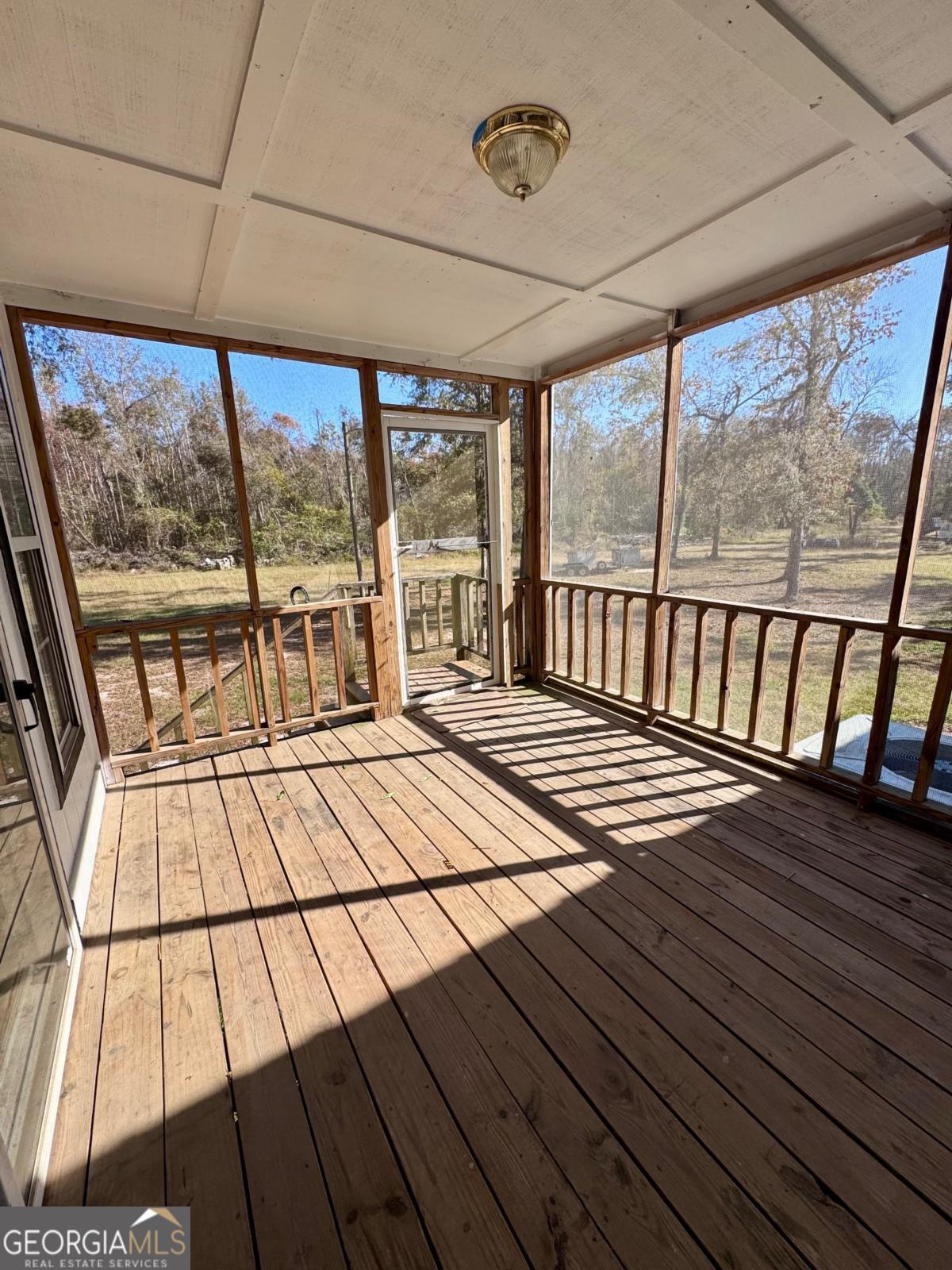 347 Benton Powell Road Uvalda, GA 30473 - Photo 20 of 39 a view of a balcony with wooden floor